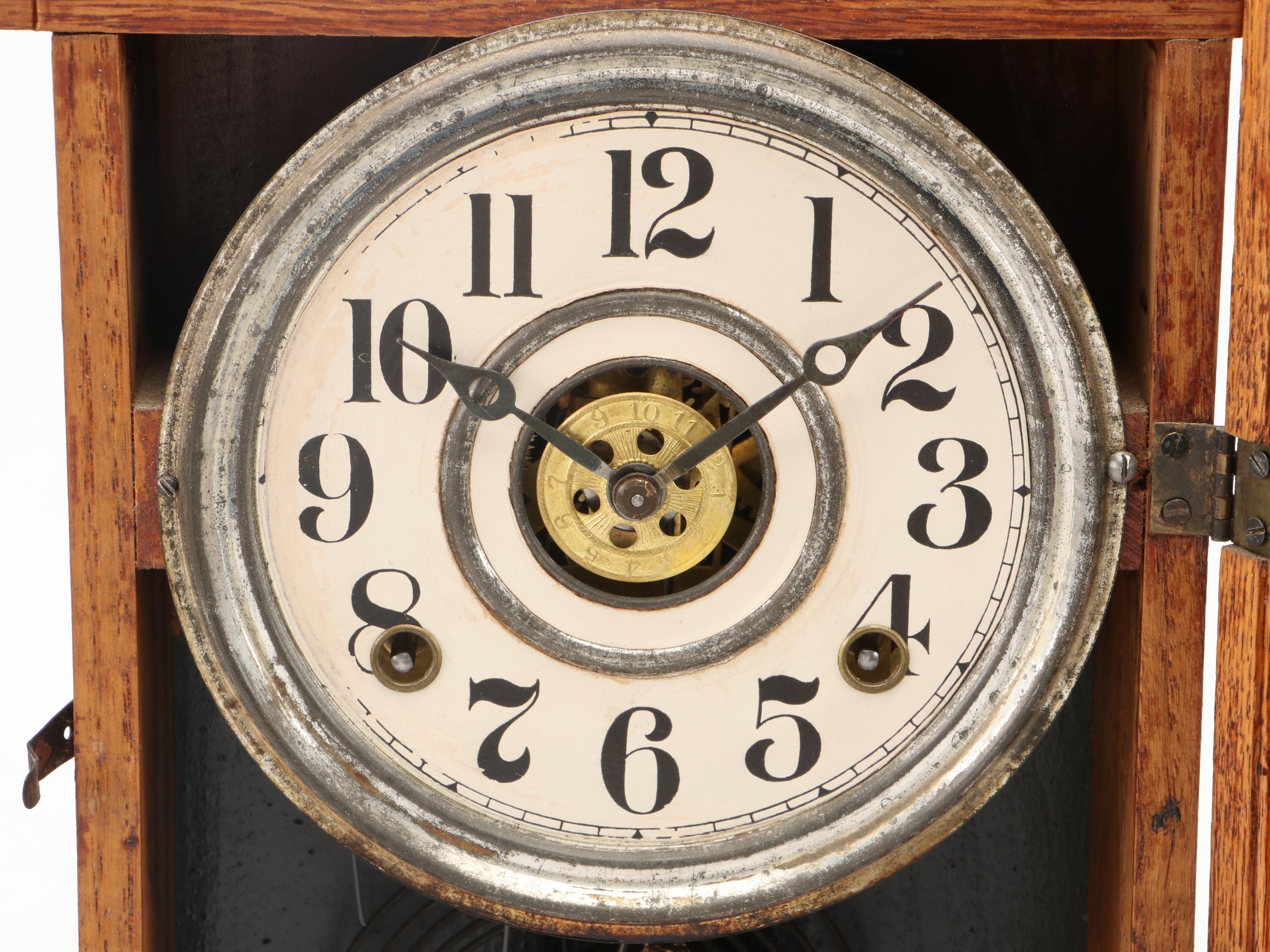 The E. Ingraham Clock Co. "Arctic" Pressed Oak Gingerbread Mantel Clock