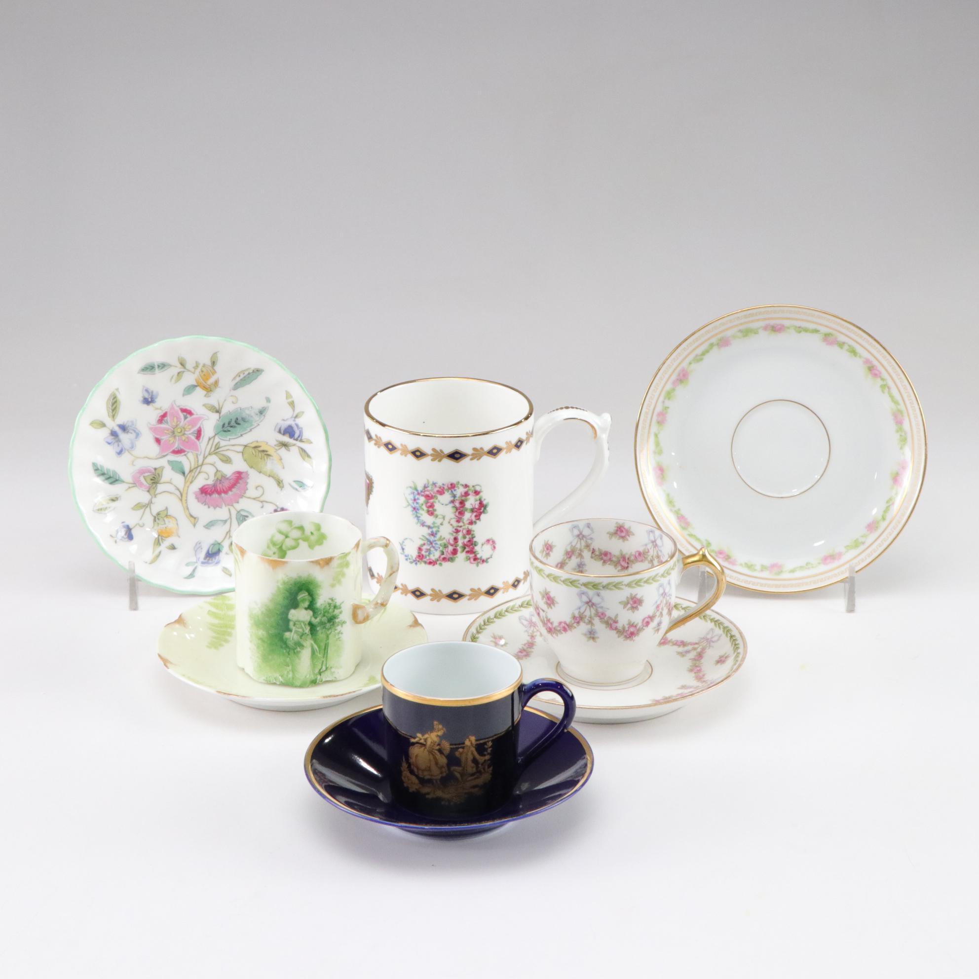 Assorted Porcelain Cups and Saucers with George III's Mug