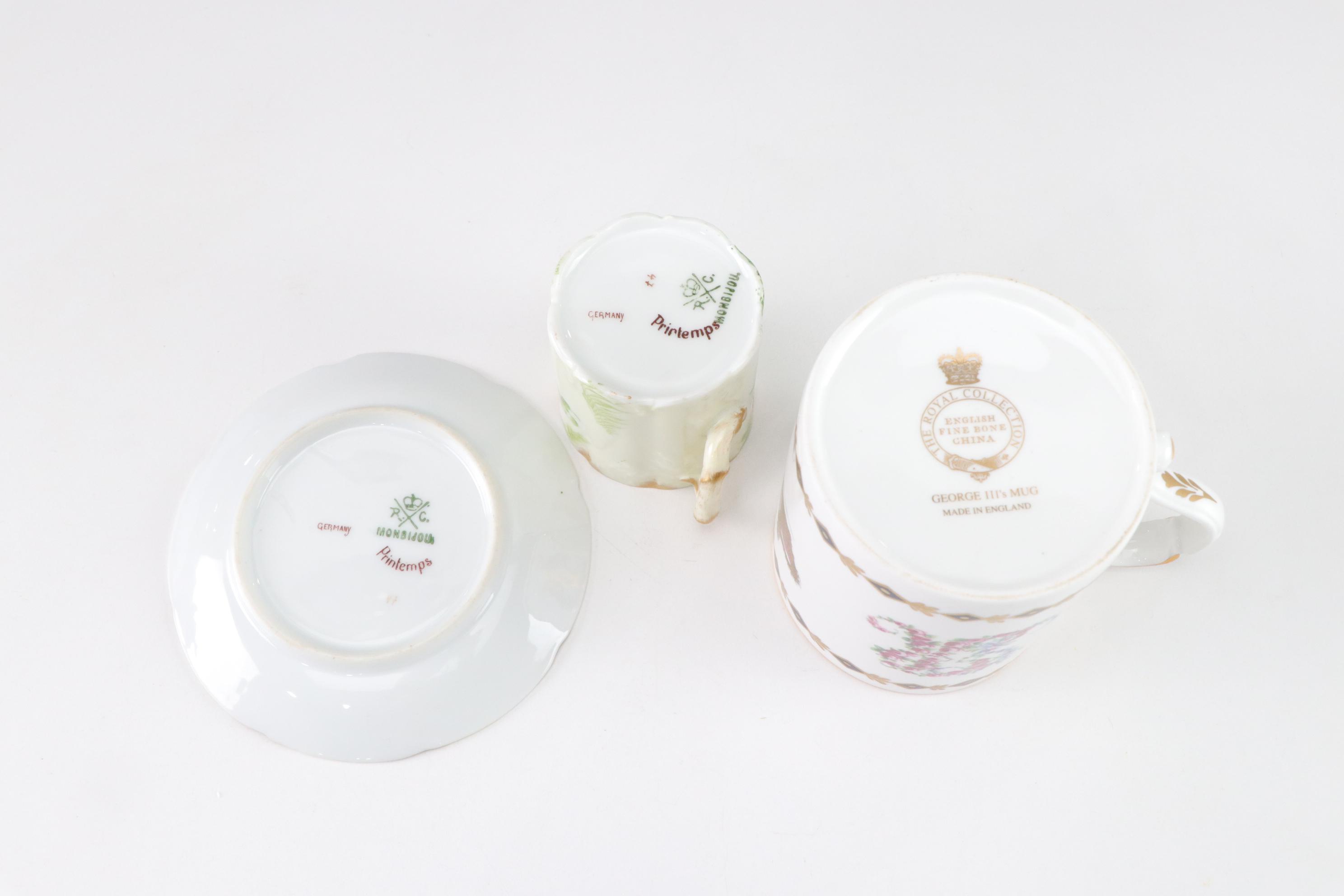 Assorted Porcelain Cups and Saucers with George III's Mug