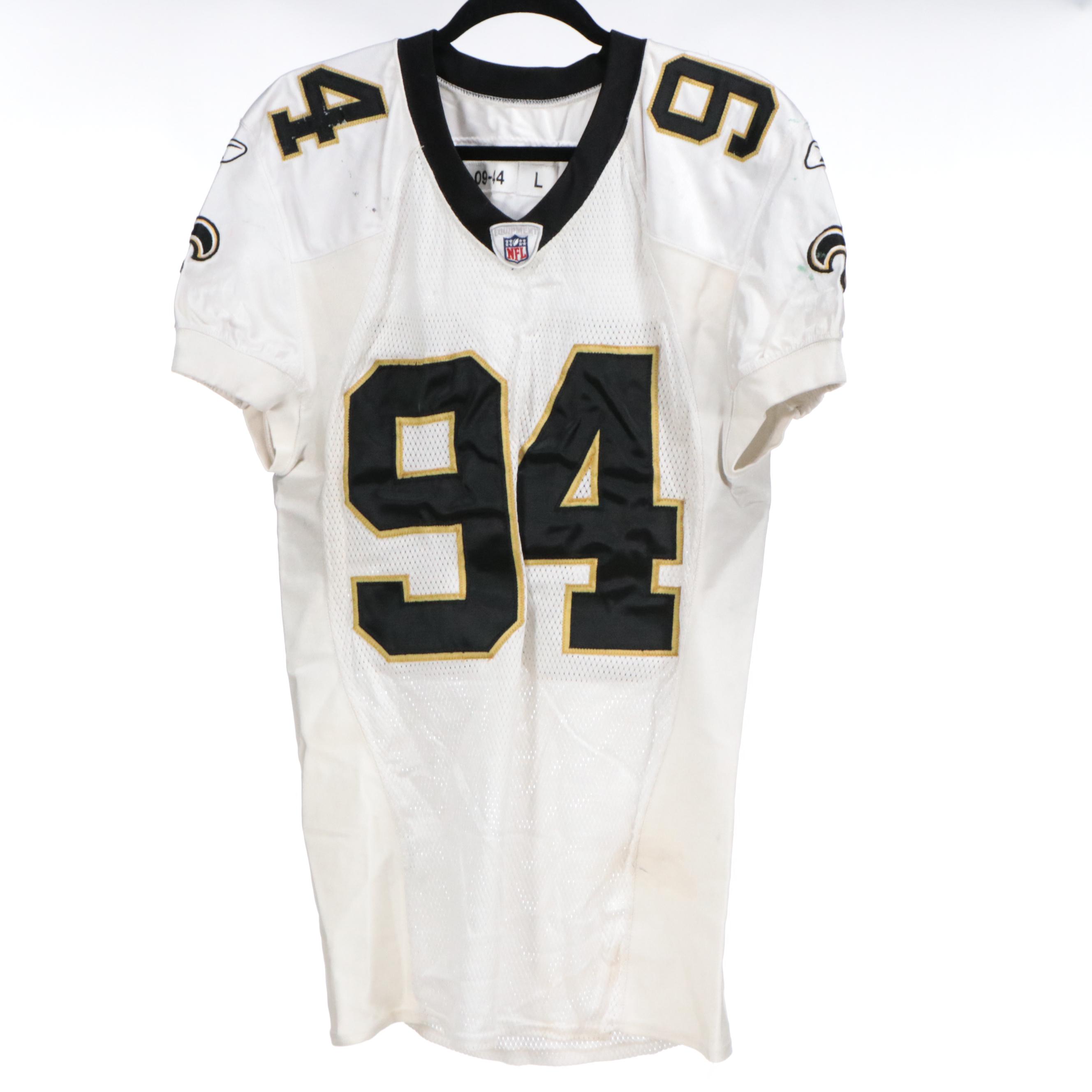 Charles Grant Game Used New Orleans Saints Jersey and Signed Football