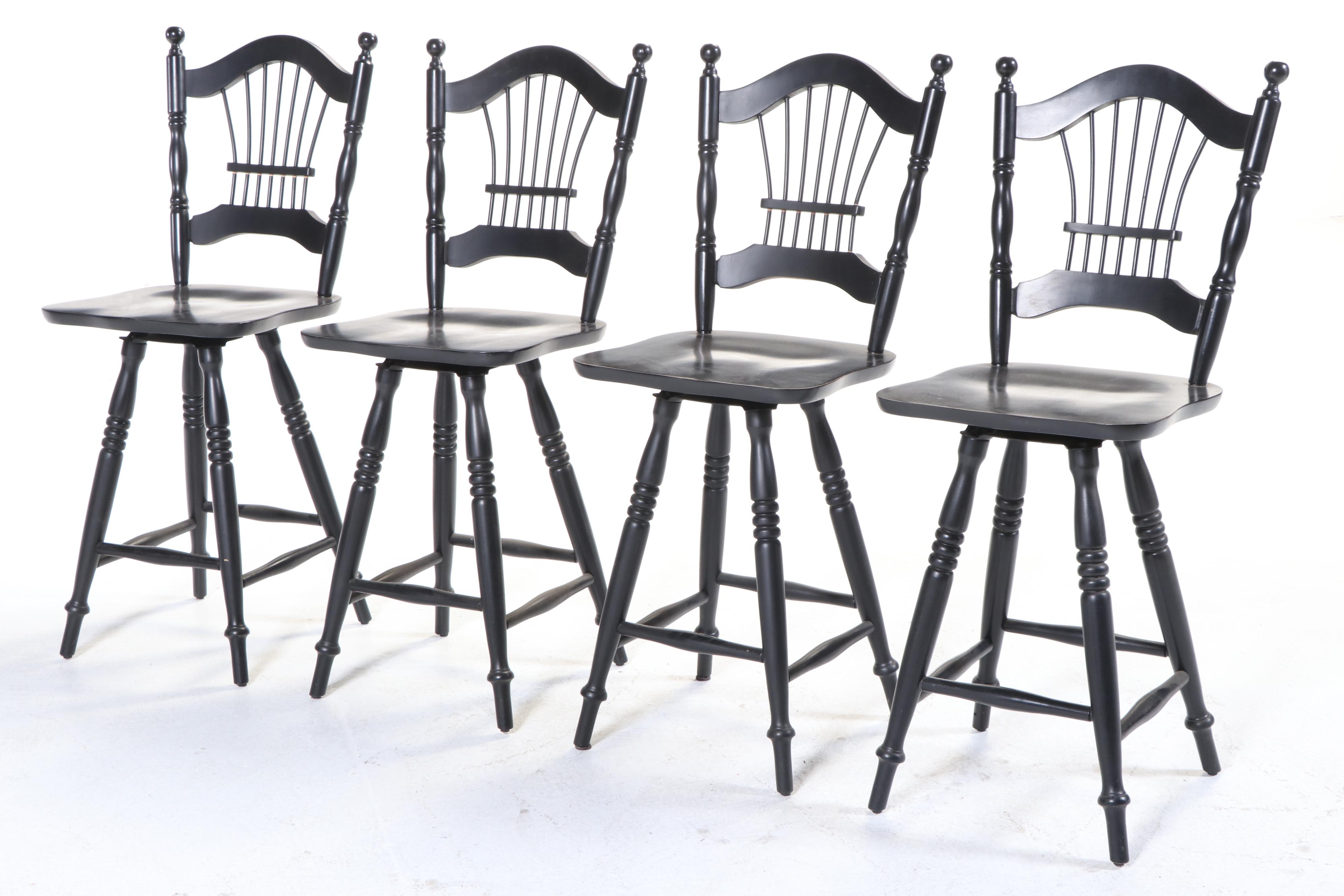 Four Colonial Style Ebonized Swivel Counter Stools