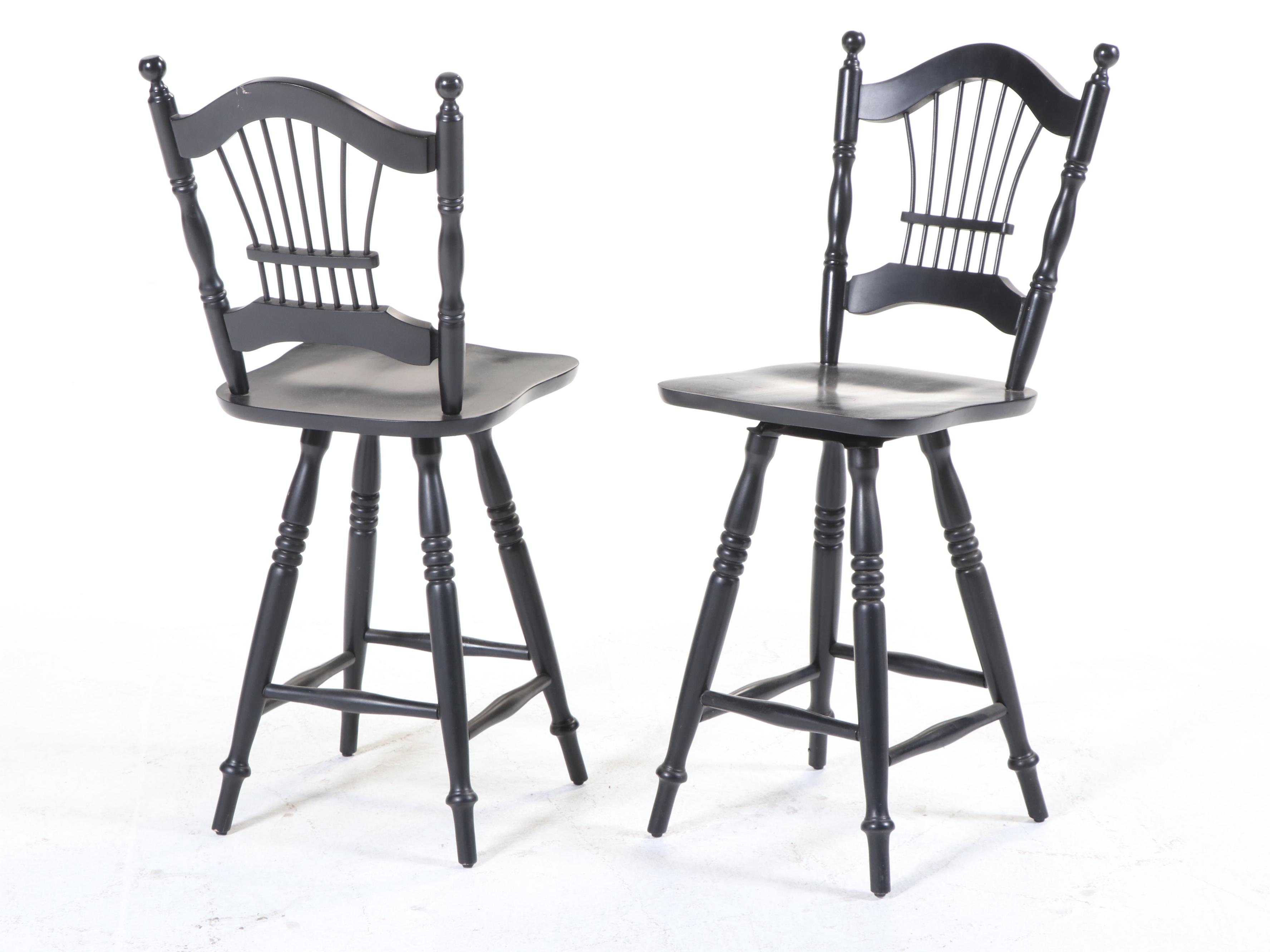 Four Colonial Style Ebonized Swivel Counter Stools