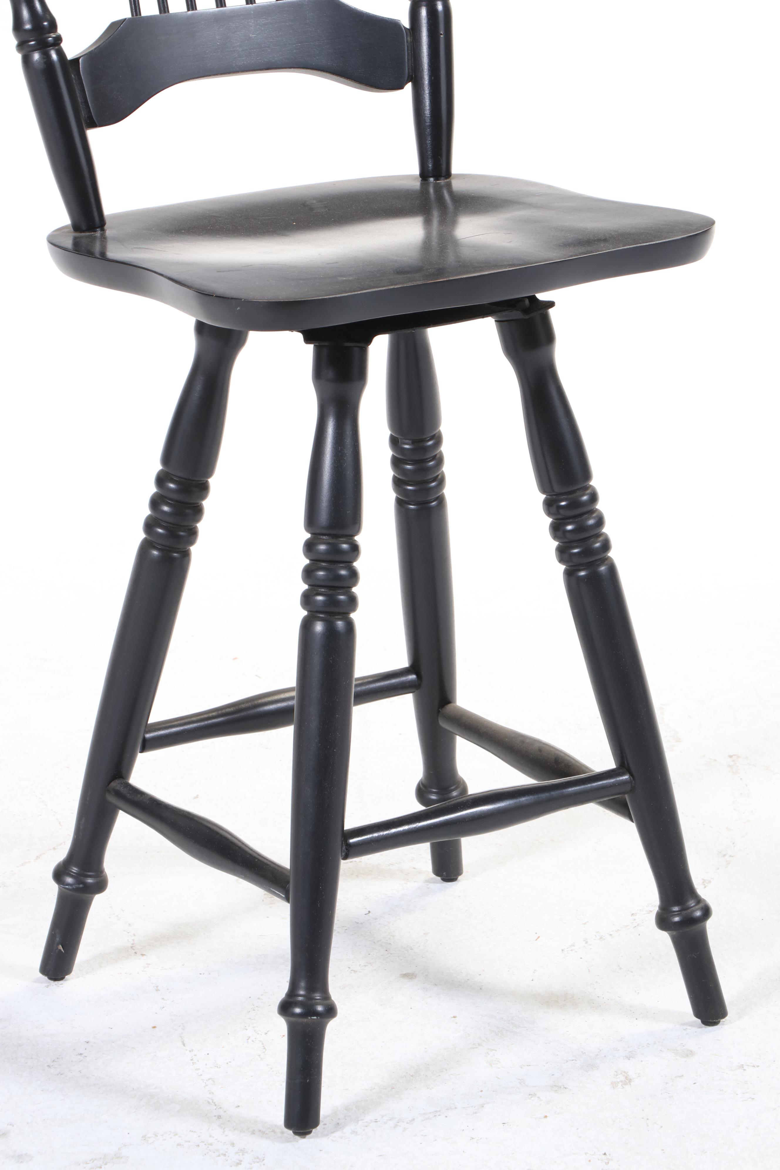 Four Colonial Style Ebonized Swivel Counter Stools