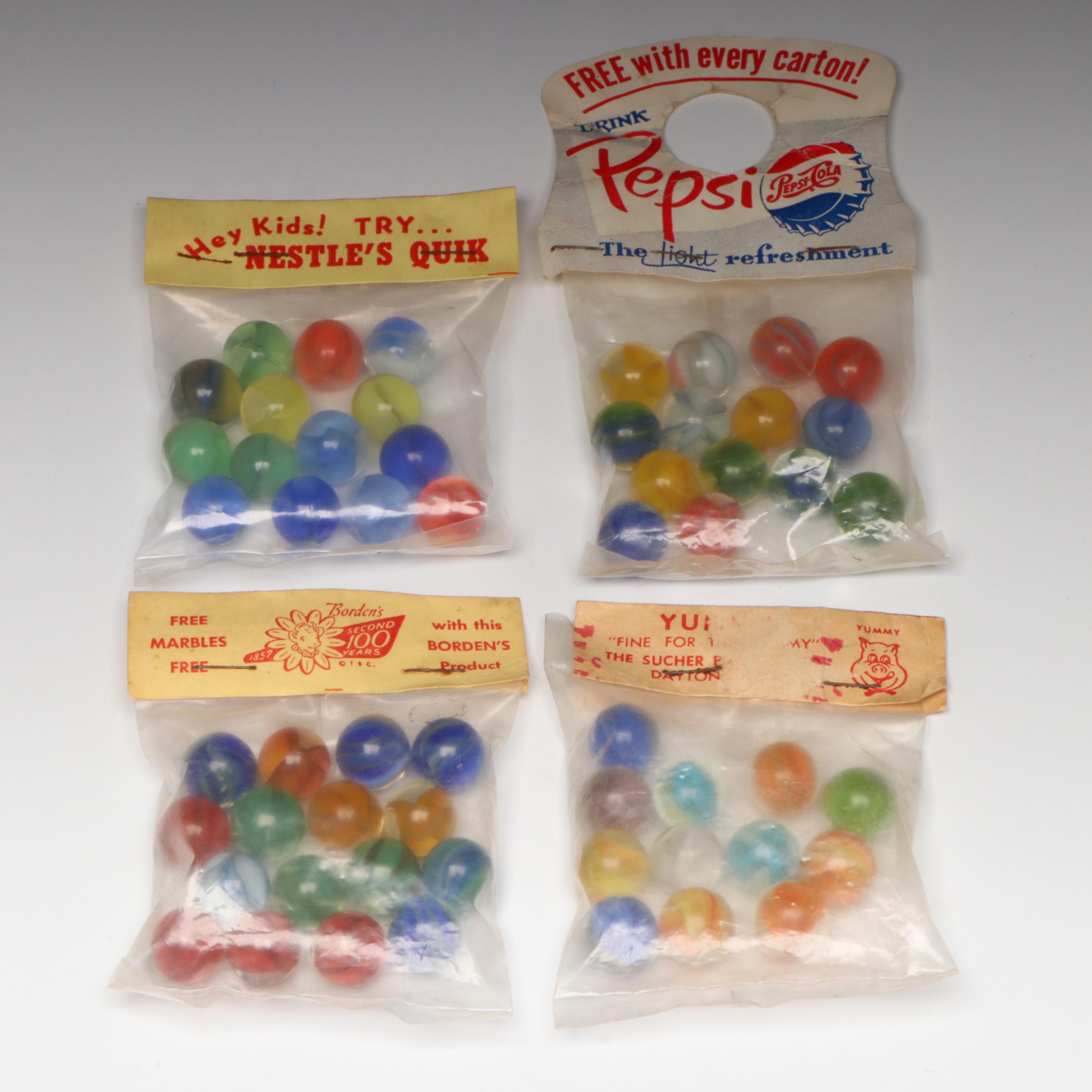 Pepsi, Nestle's Quik, Yummy and Borden's Cat's Eye Glass Marbles in Packaging