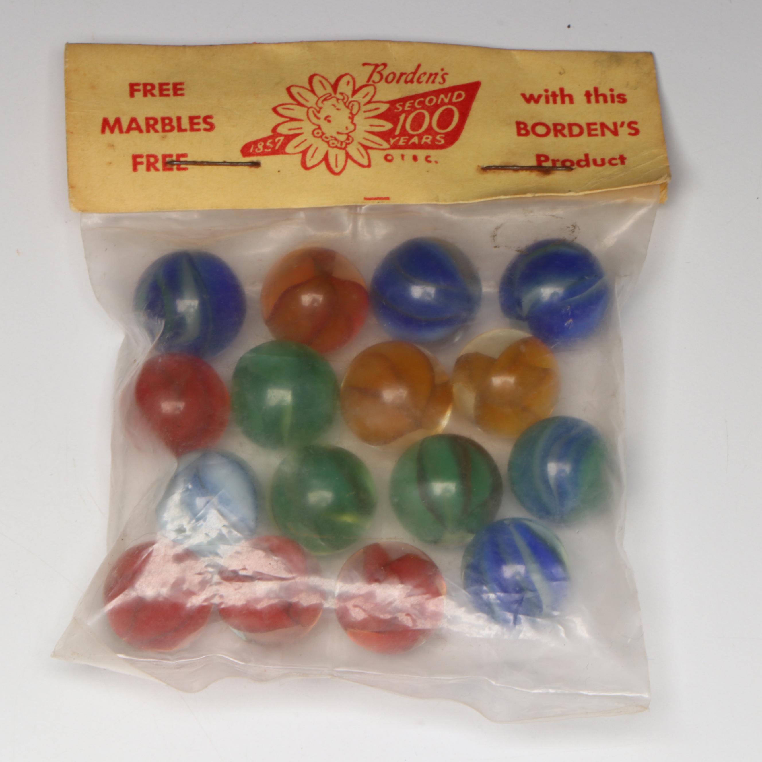 Pepsi, Nestle's Quik, Yummy and Borden's Cat's Eye Glass Marbles in Packaging