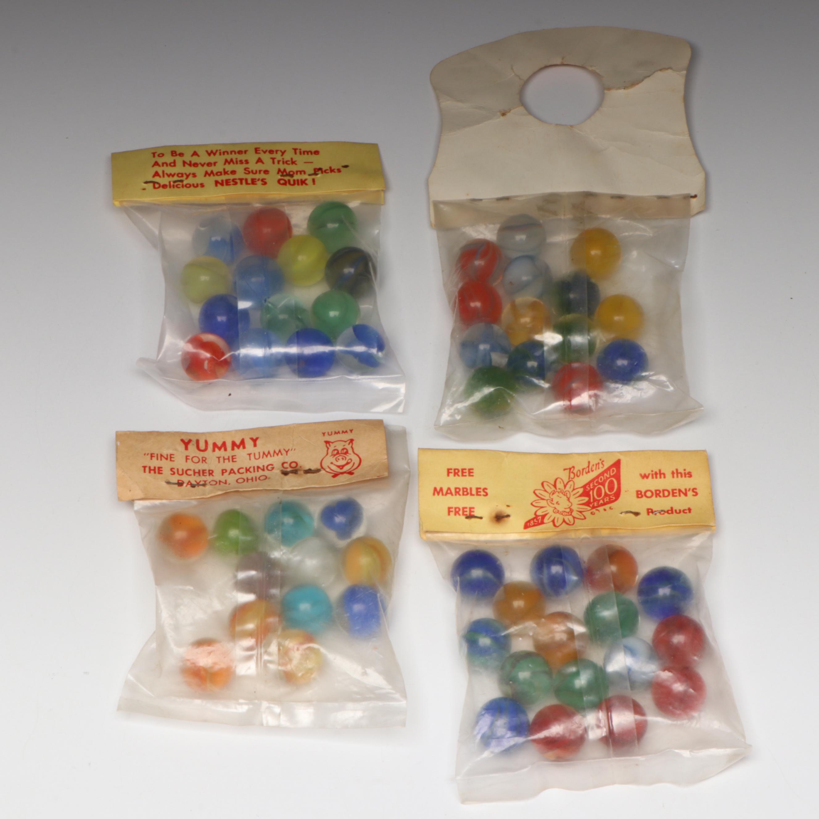 Pepsi, Nestle's Quik, Yummy and Borden's Cat's Eye Glass Marbles in Packaging
