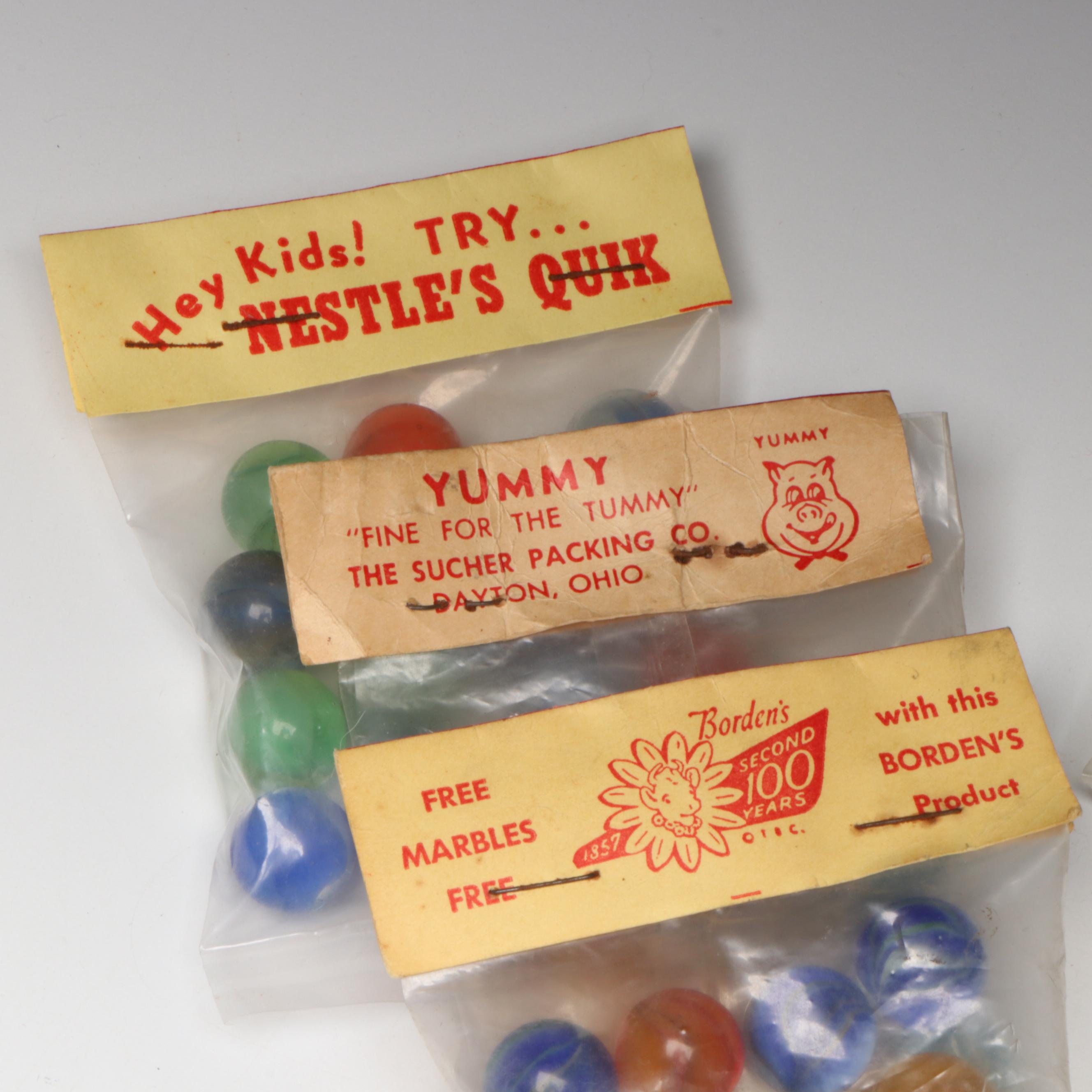 Pepsi, Nestle's Quik, Yummy and Borden's Cat's Eye Glass Marbles in Packaging