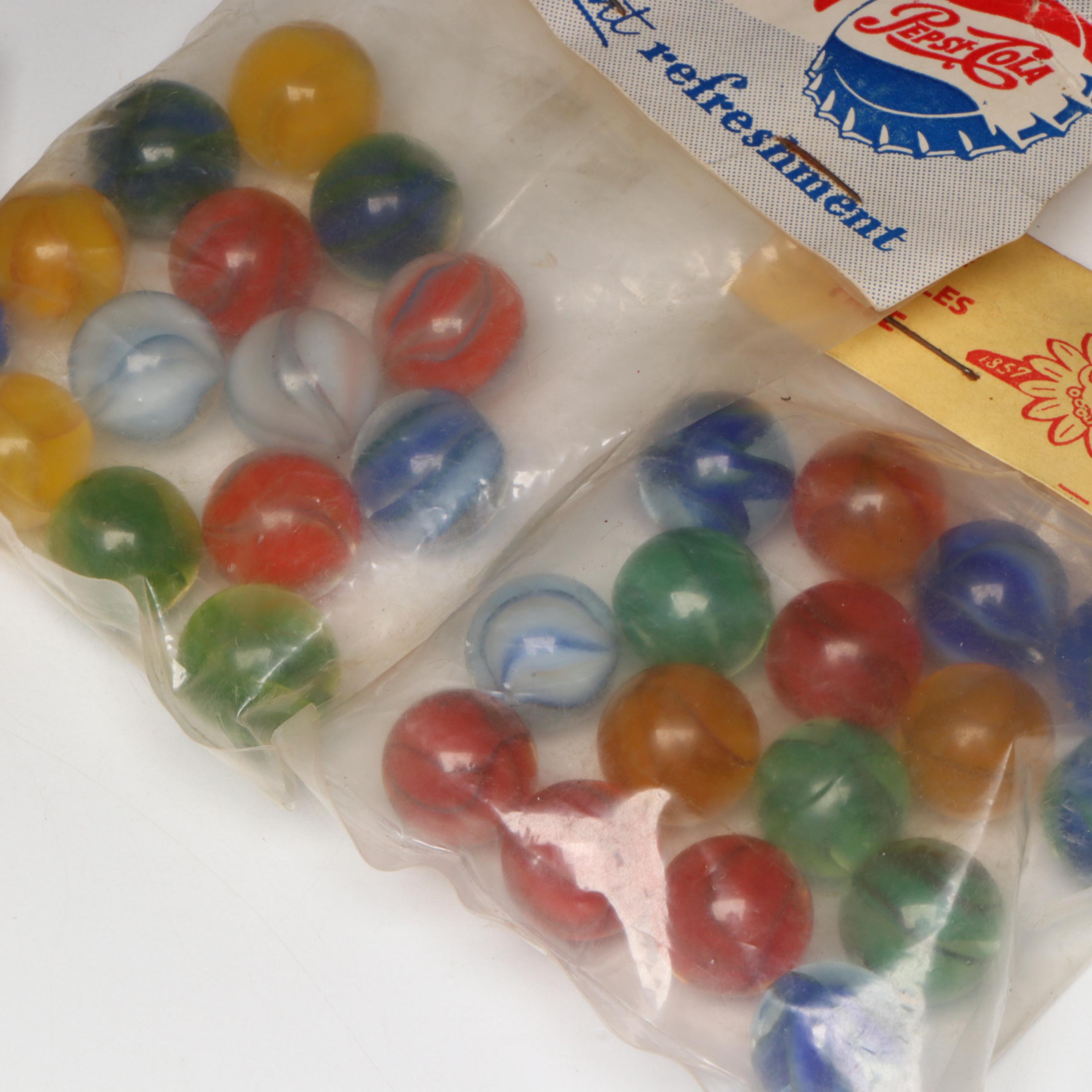Pepsi, Nestle's Quik, Yummy and Borden's Cat's Eye Glass Marbles in Packaging