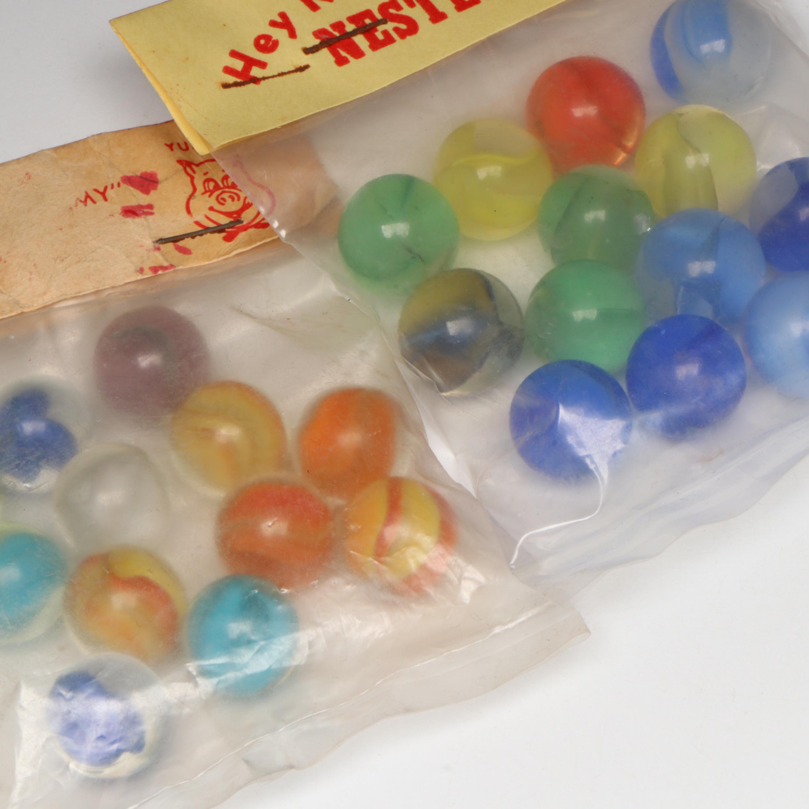 Pepsi, Nestle's Quik, Yummy and Borden's Cat's Eye Glass Marbles in Packaging