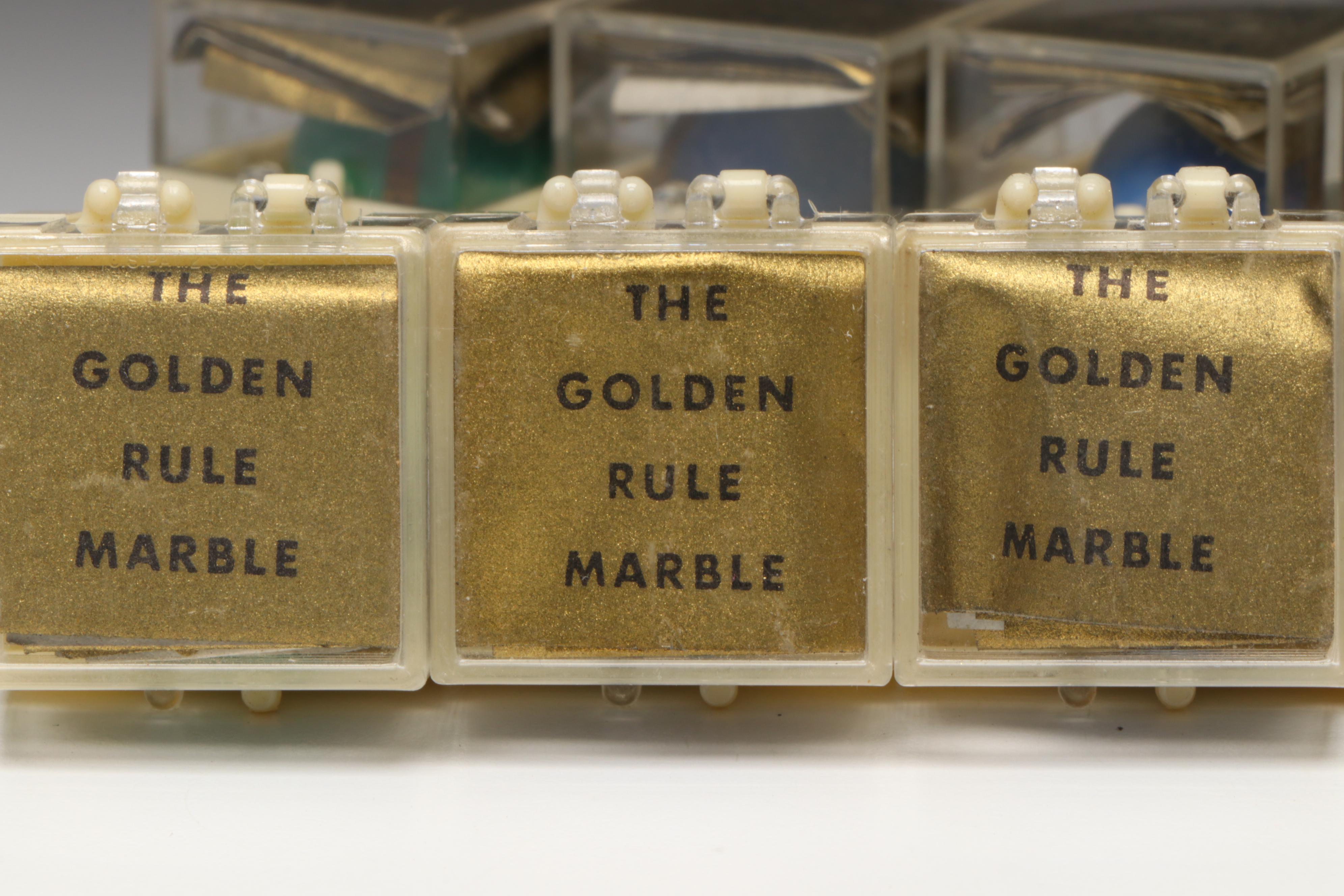 The Golden Rule Acrylic Marbles with Brass Bands, 1960s