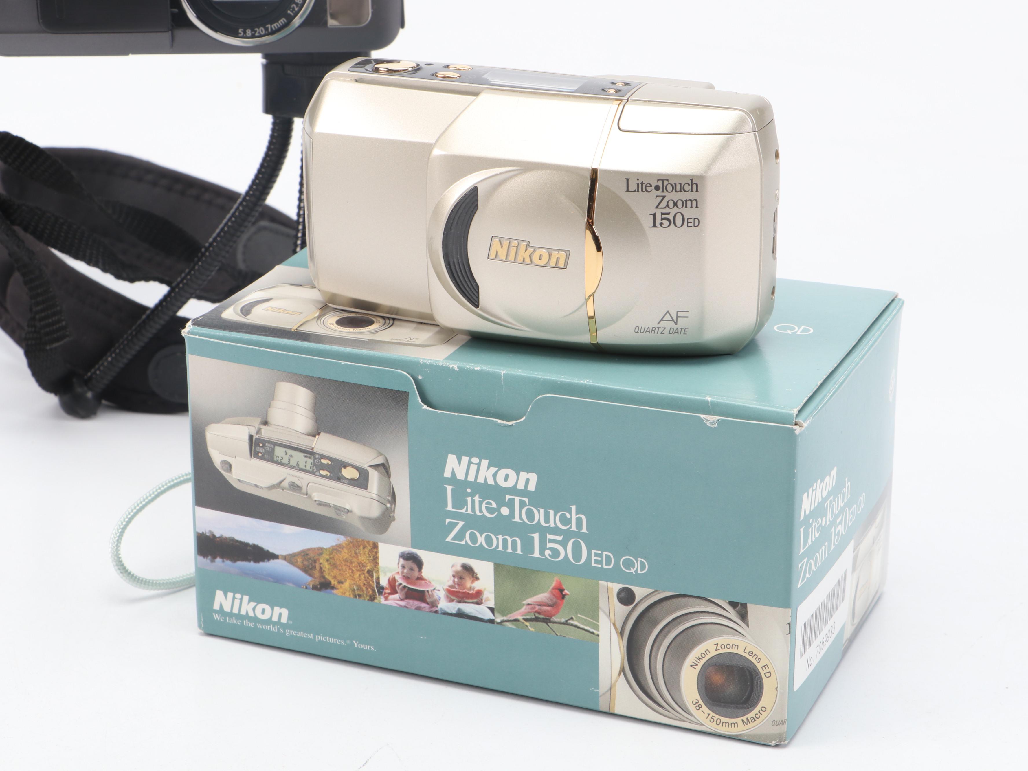 Canon PowerShot S70 and Nikon Life-Touch Zoom 150 ED with Cards and Bag