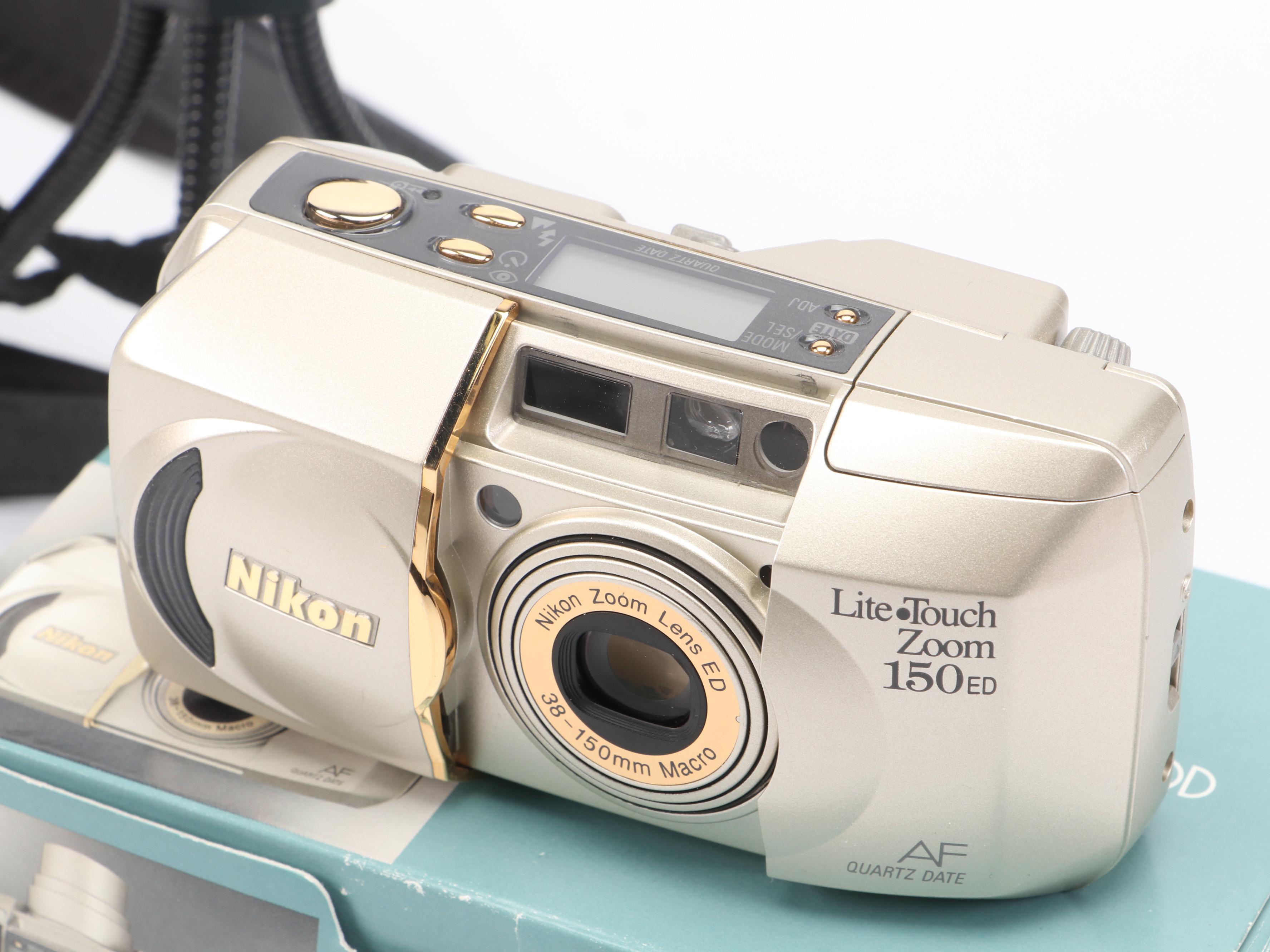 Canon PowerShot S70 and Nikon Life-Touch Zoom 150 ED with Cards and Bag