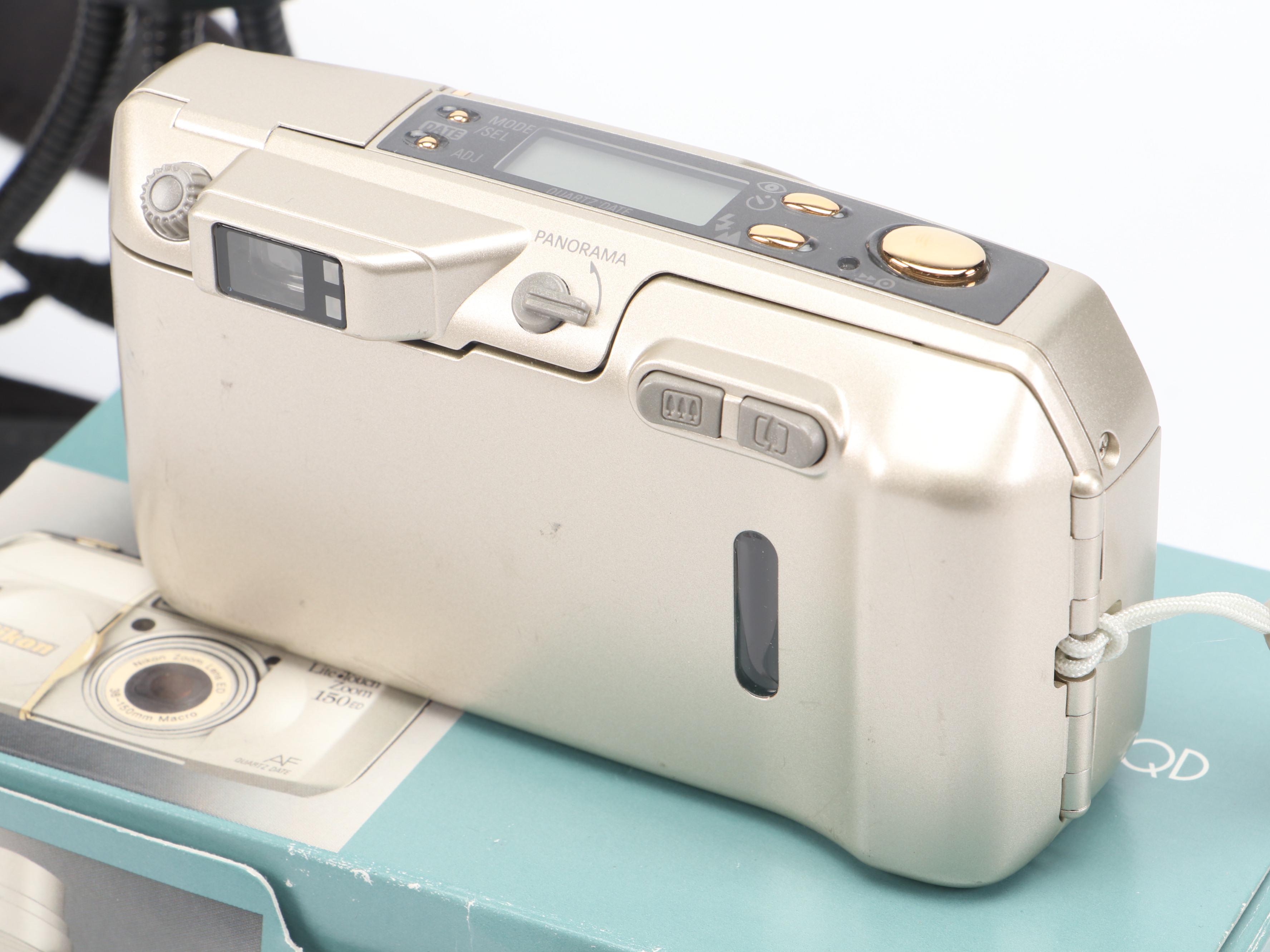 Canon PowerShot S70 and Nikon Life-Touch Zoom 150 ED with Cards and Bag