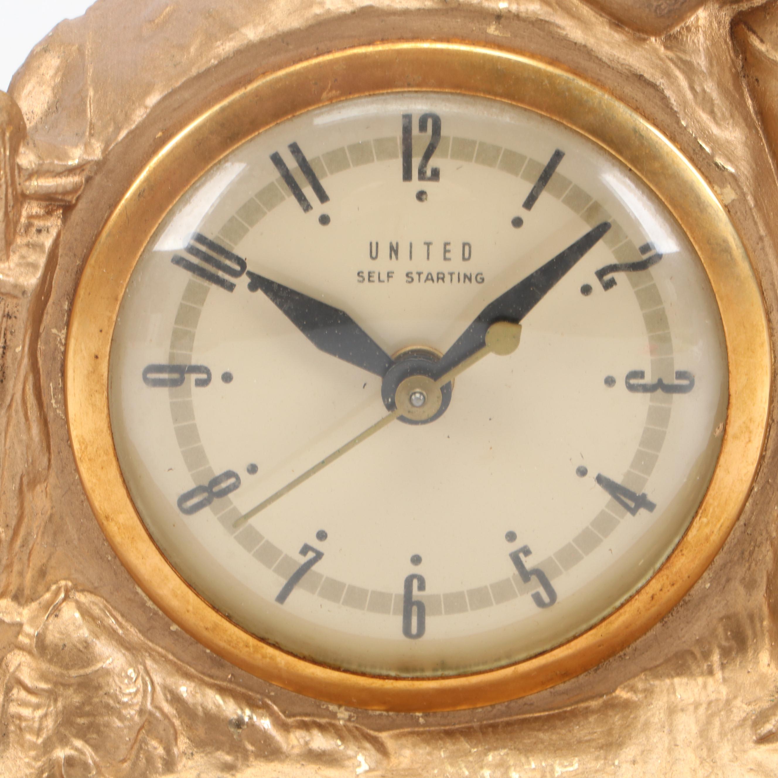 United Clock Corp. Gilt Metal Fishing Boy Mantel Clock, Mid-20th C.