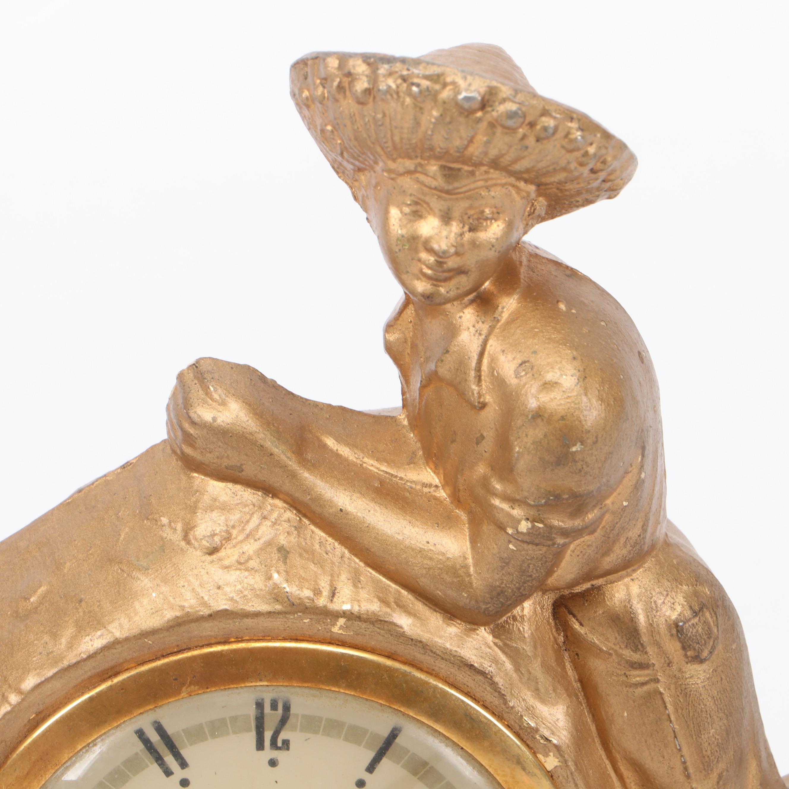 United Clock Corp. Gilt Metal Fishing Boy Mantel Clock, Mid-20th C.