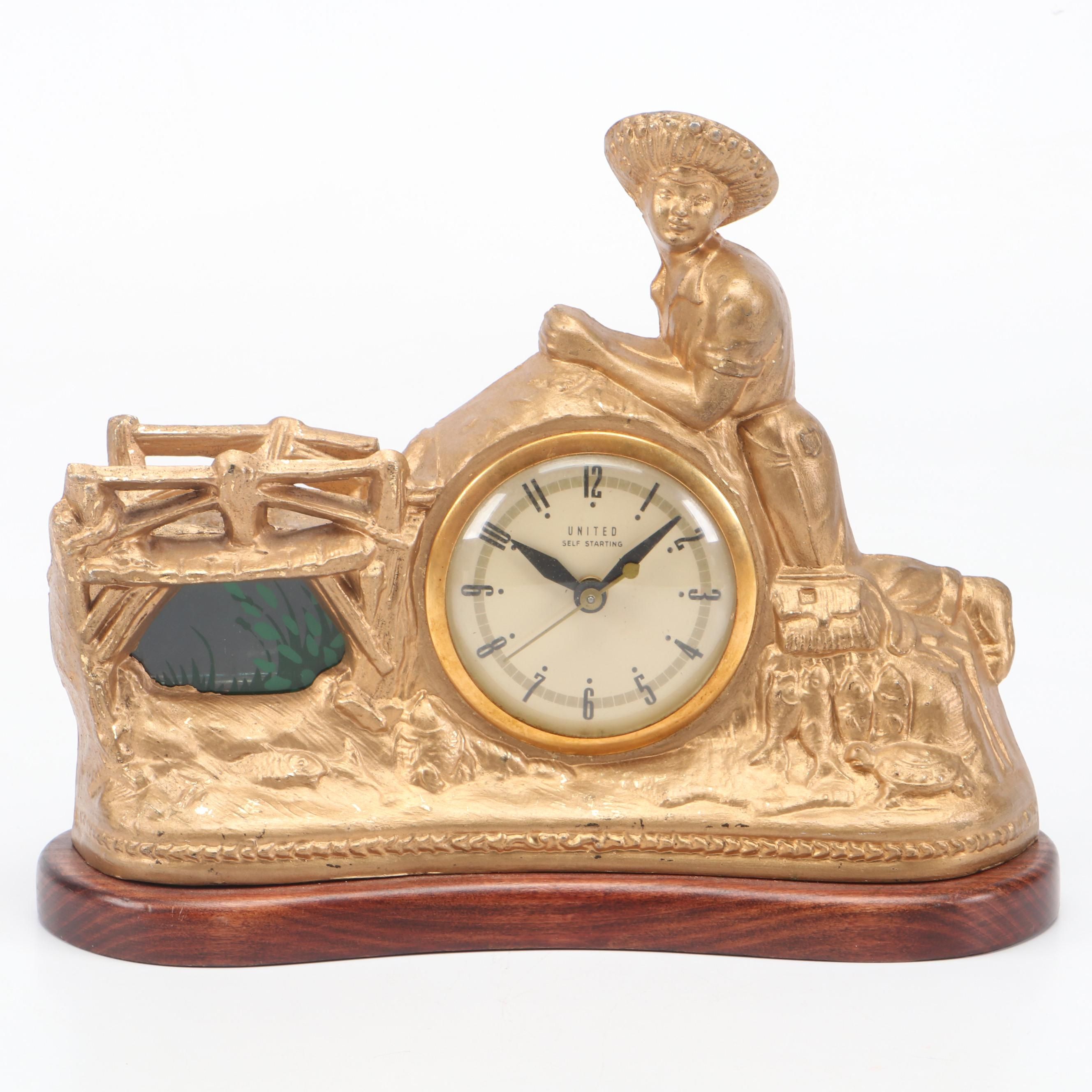 United Clock Corp. Gilt Metal Fishing Boy Mantel Clock, Mid-20th C.