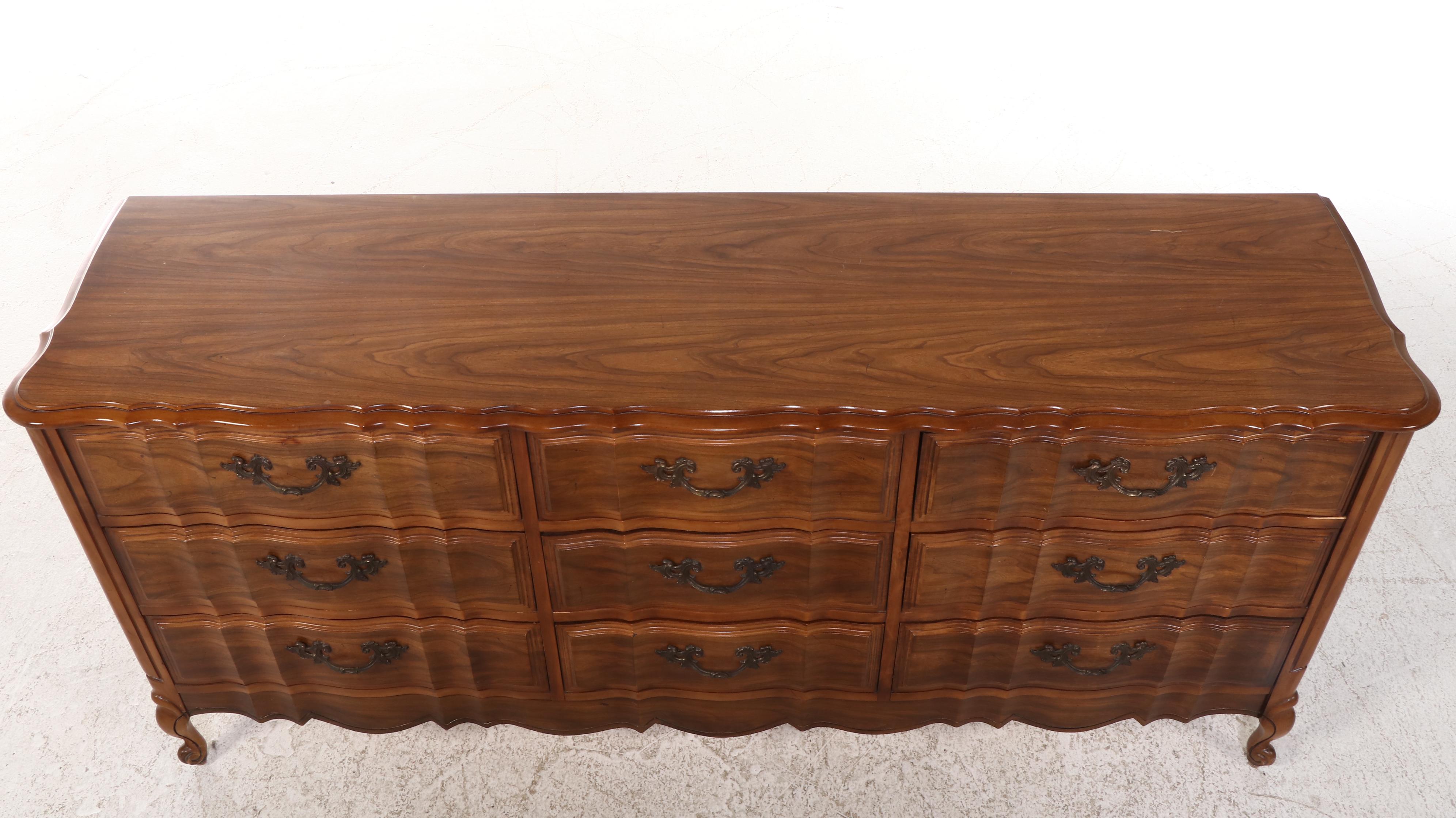 French Provincial Style Fruitwood-Stained Nine-Drawer Serpentine Dresser