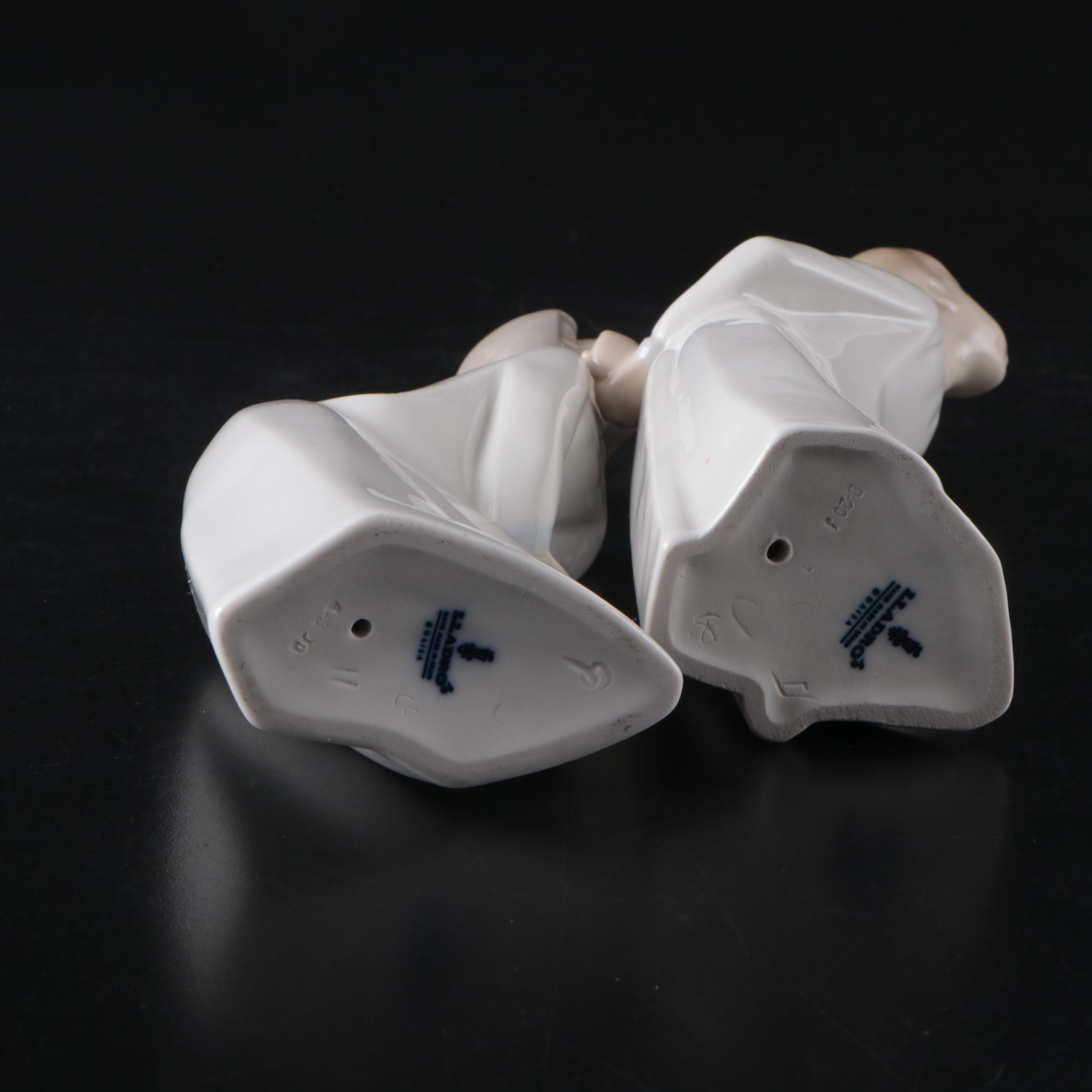 Lladró Kissing Girl and Boy Porcelain Figurines, Designed by Fulgencio Garcia