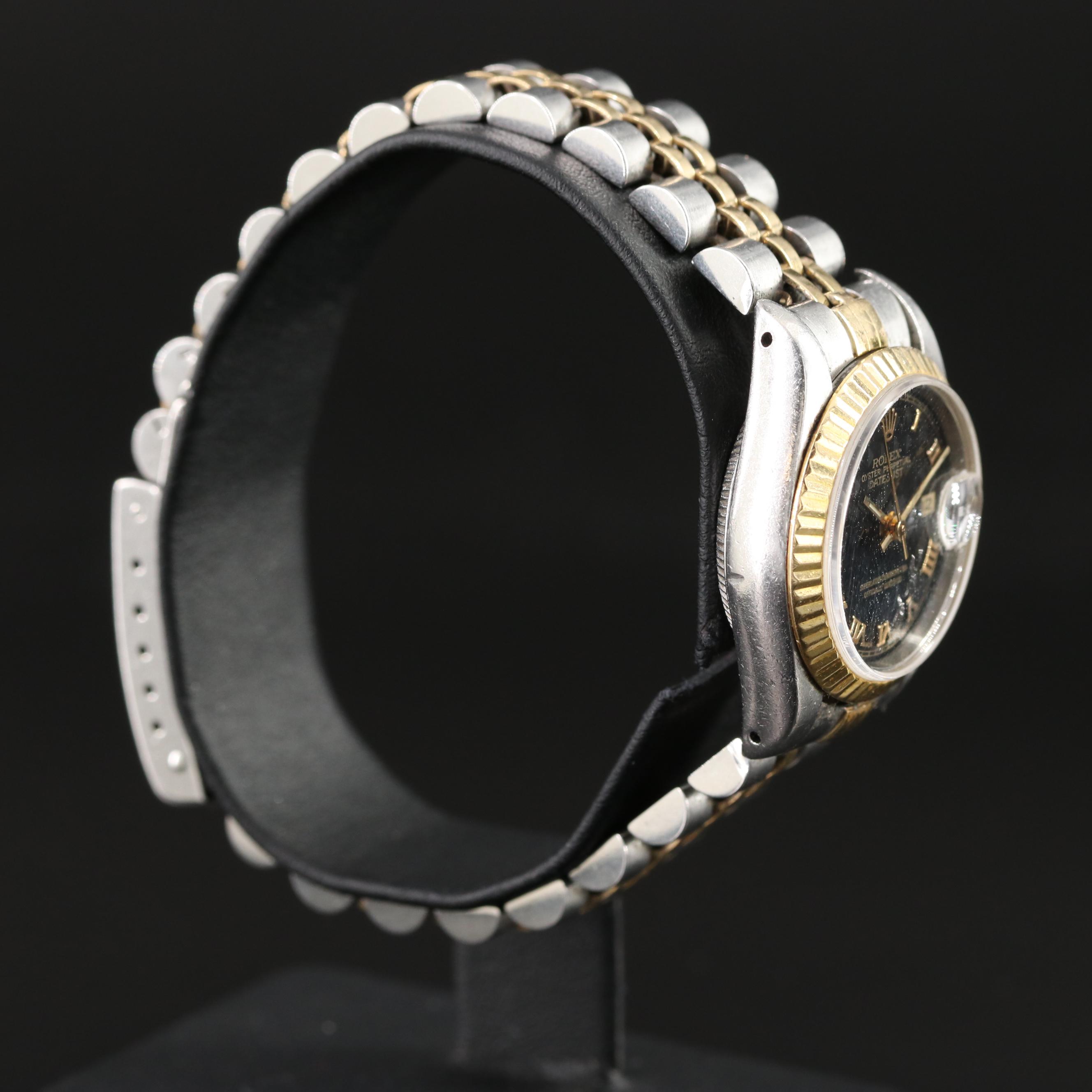 1991 18K Gold and Steelinox Rolex Black Pyramid Roman Dial Datejust Watch