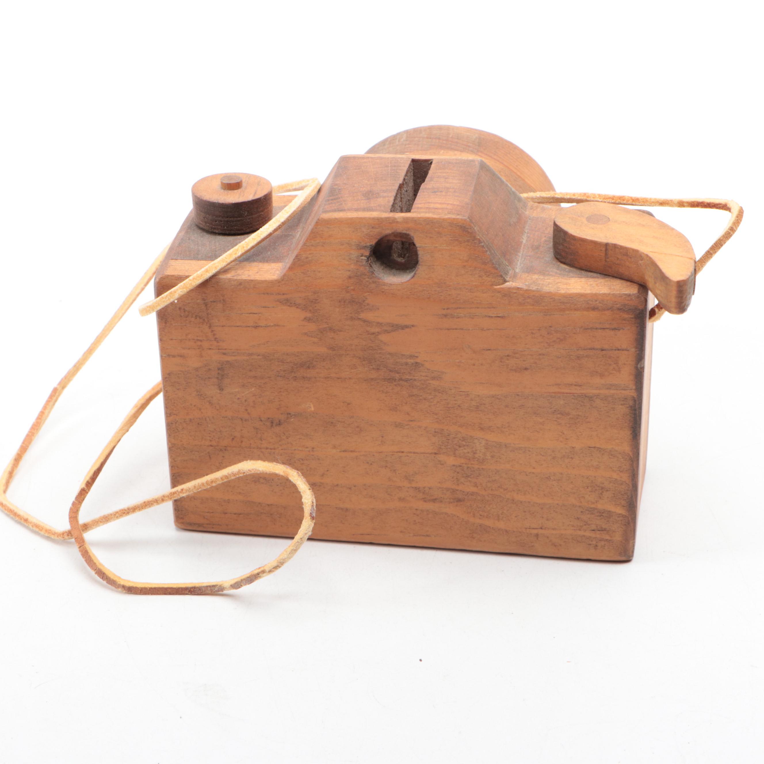 Carved Wooden Duck, Camera, Weeping Buddha and Rolling Pin