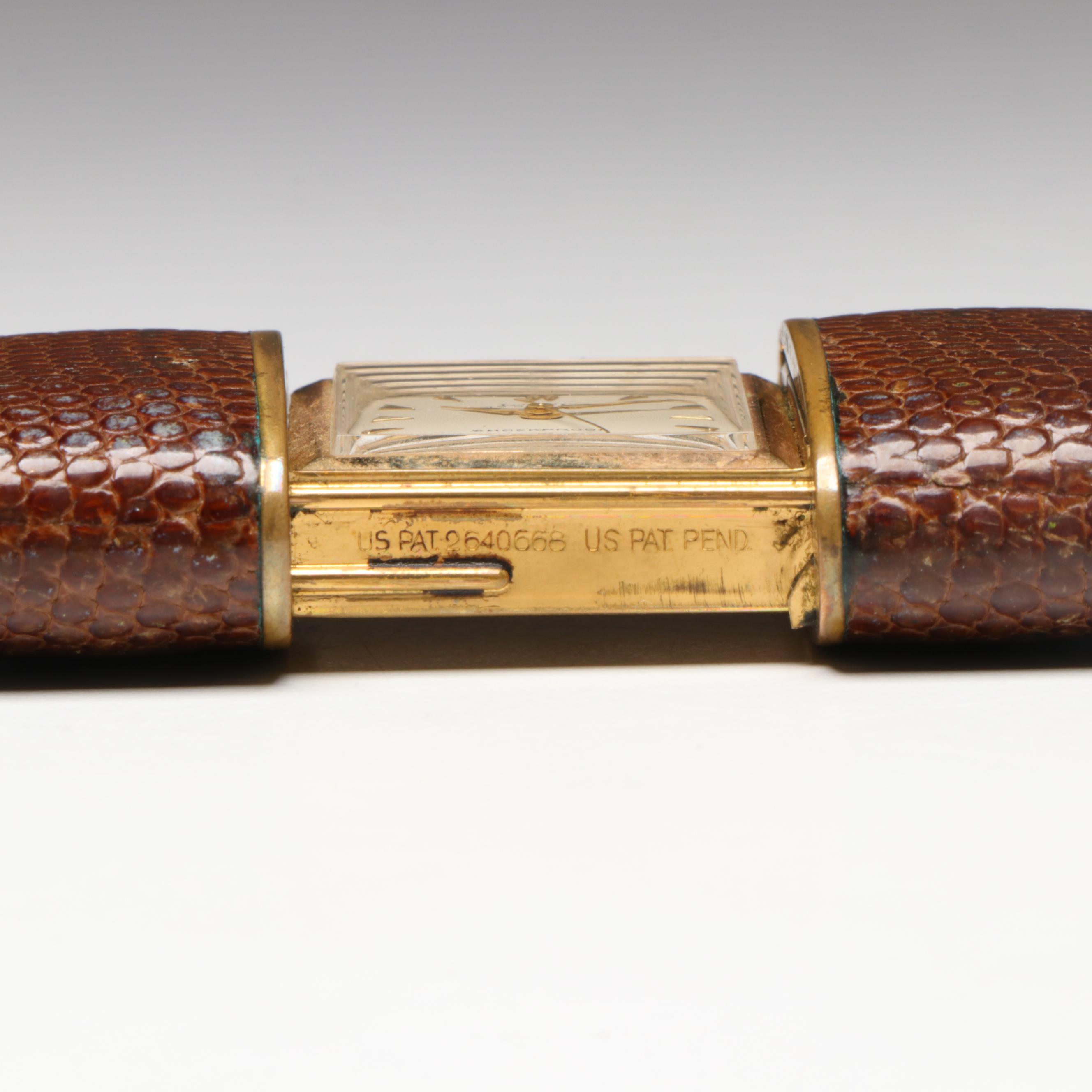 German Laco 17 Jewel Travel Clock with Sliding Lizard Skin Case, circa 1953