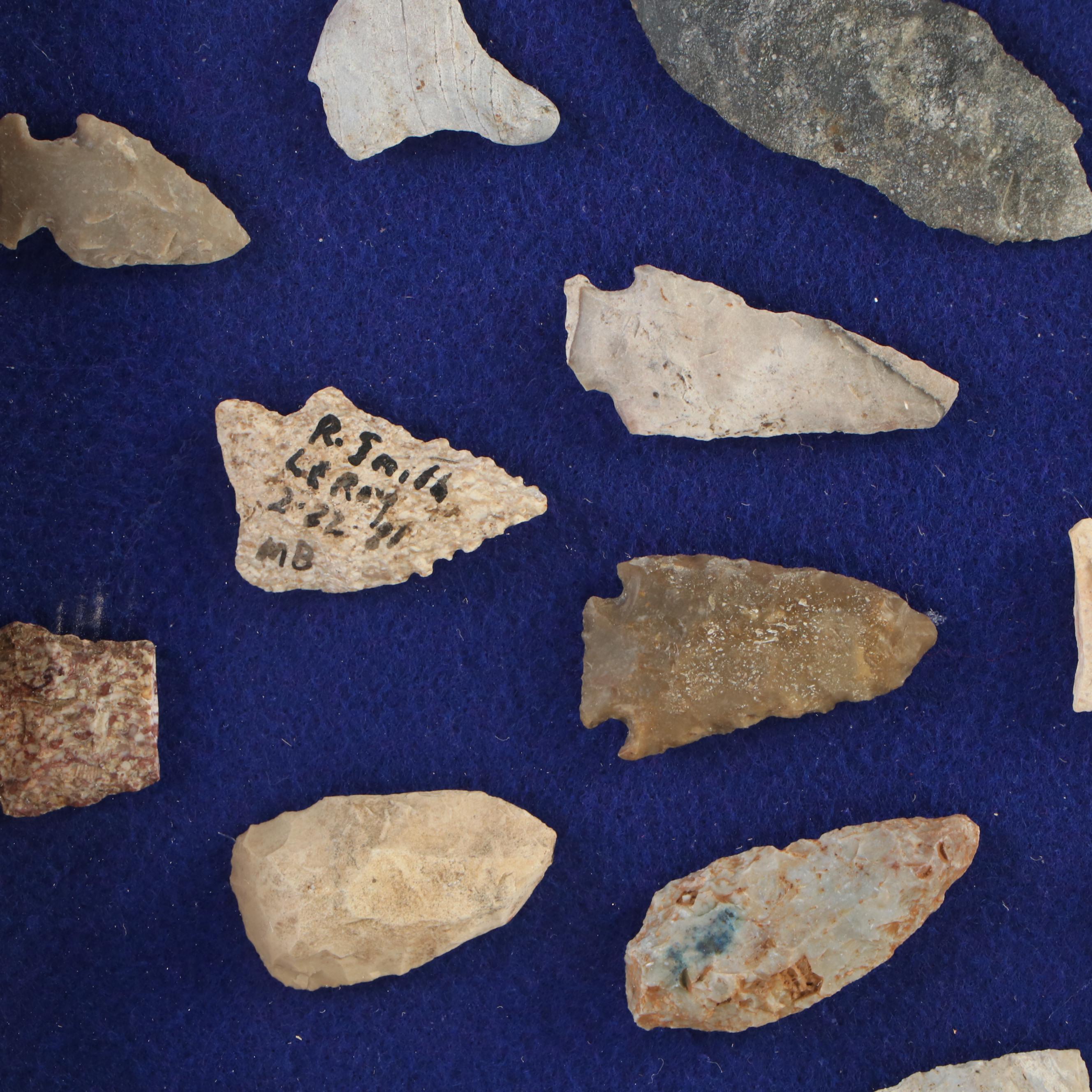 Knapped Stone Projectile Points, Beads, and Knapping Stone in Display Case