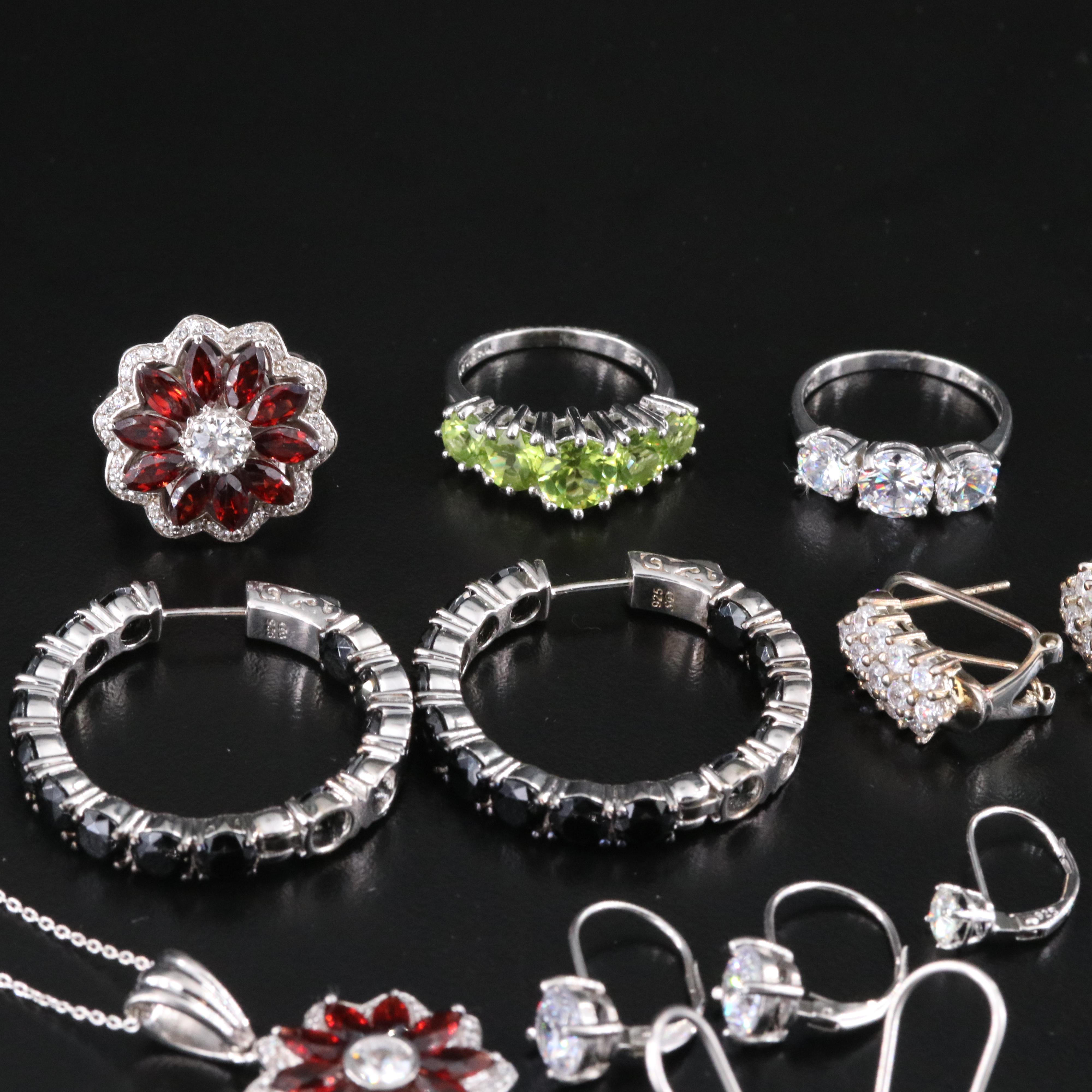 Sterling Gemstone Jewelry Collection Including Tanzanite, Garnet, and Topaz