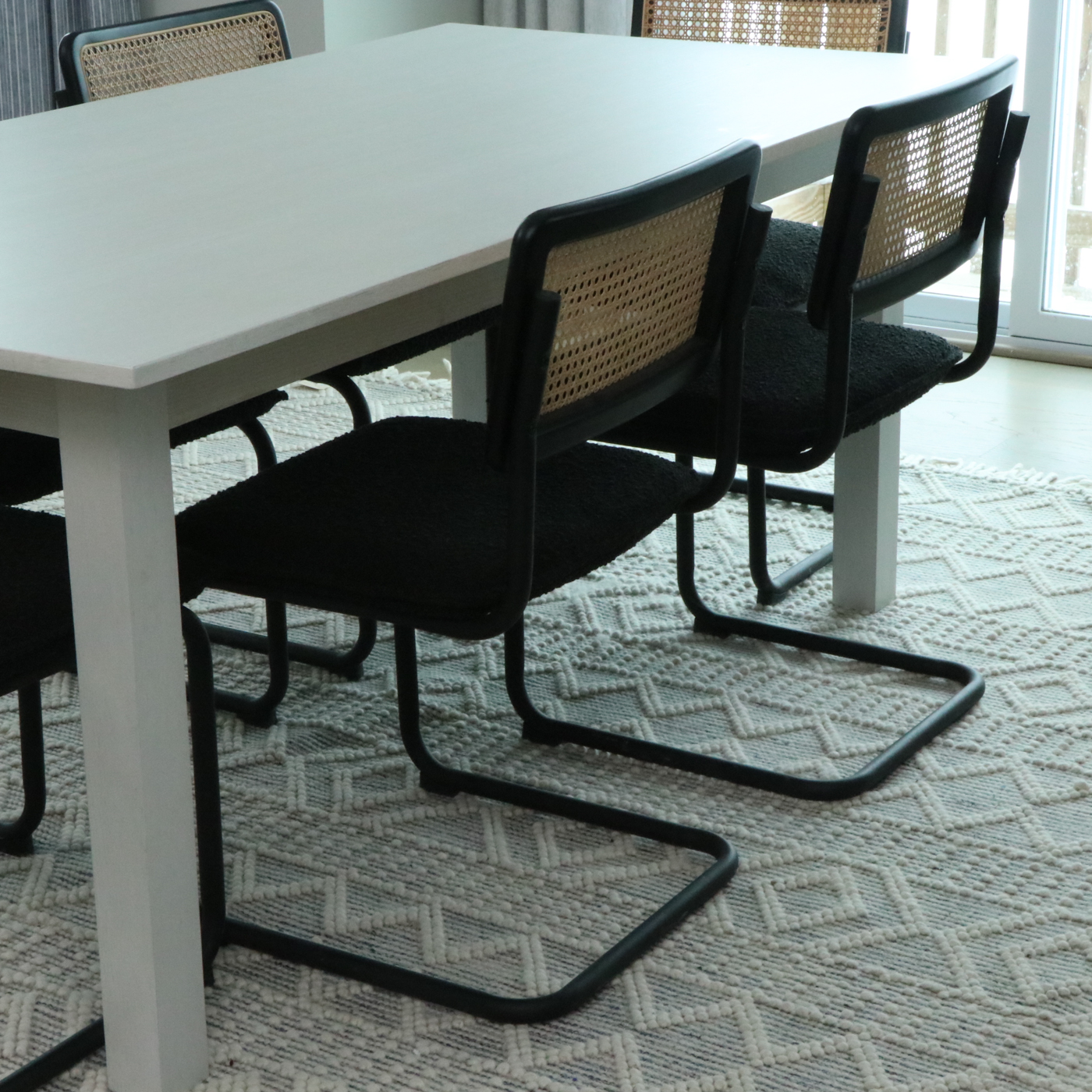 Universal Furniture Laminate Dining Table and Cane-Back Sled Base Chairs