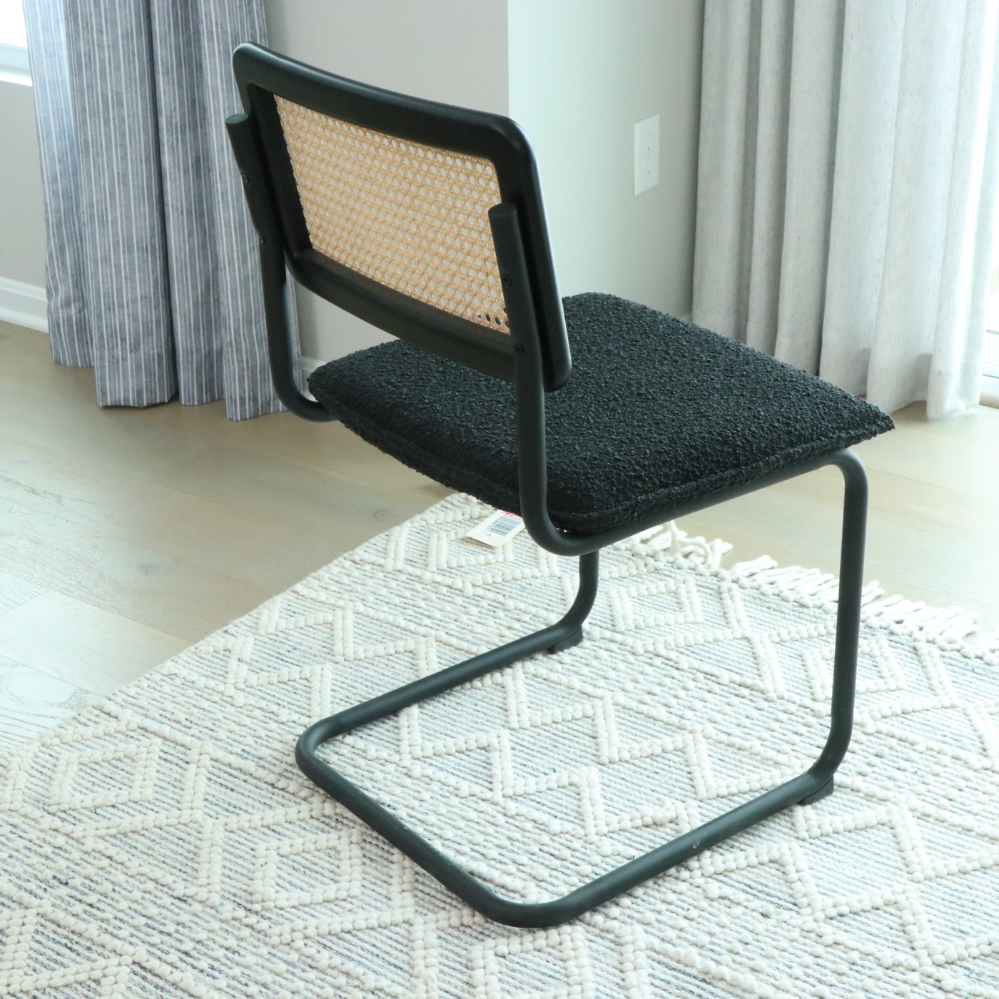 Universal Furniture Laminate Dining Table and Cane-Back Sled Base Chairs