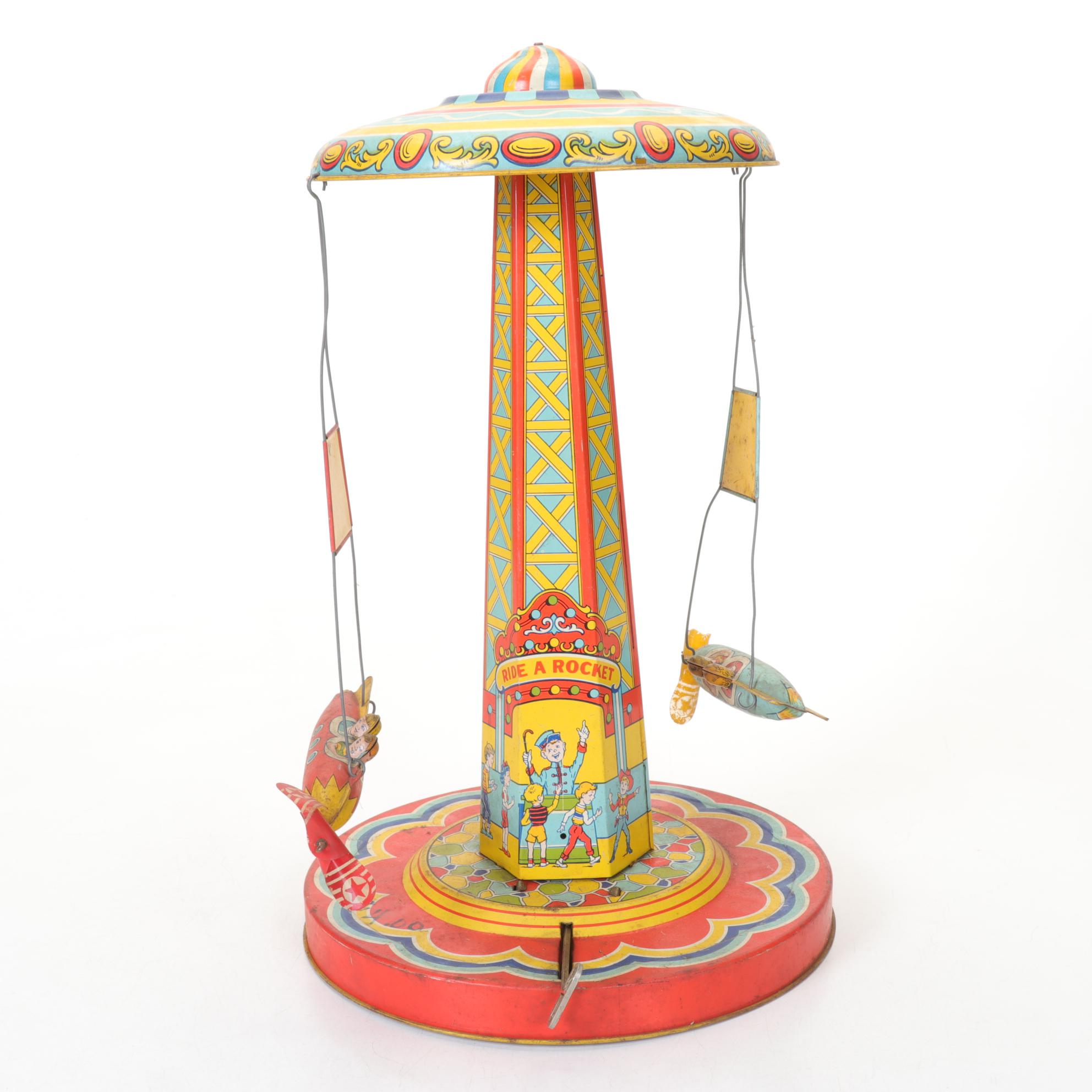J. Chein "Ride a Rocket" Tin Litho Wind-Up Toy with Two Ohio Art Metal Tops