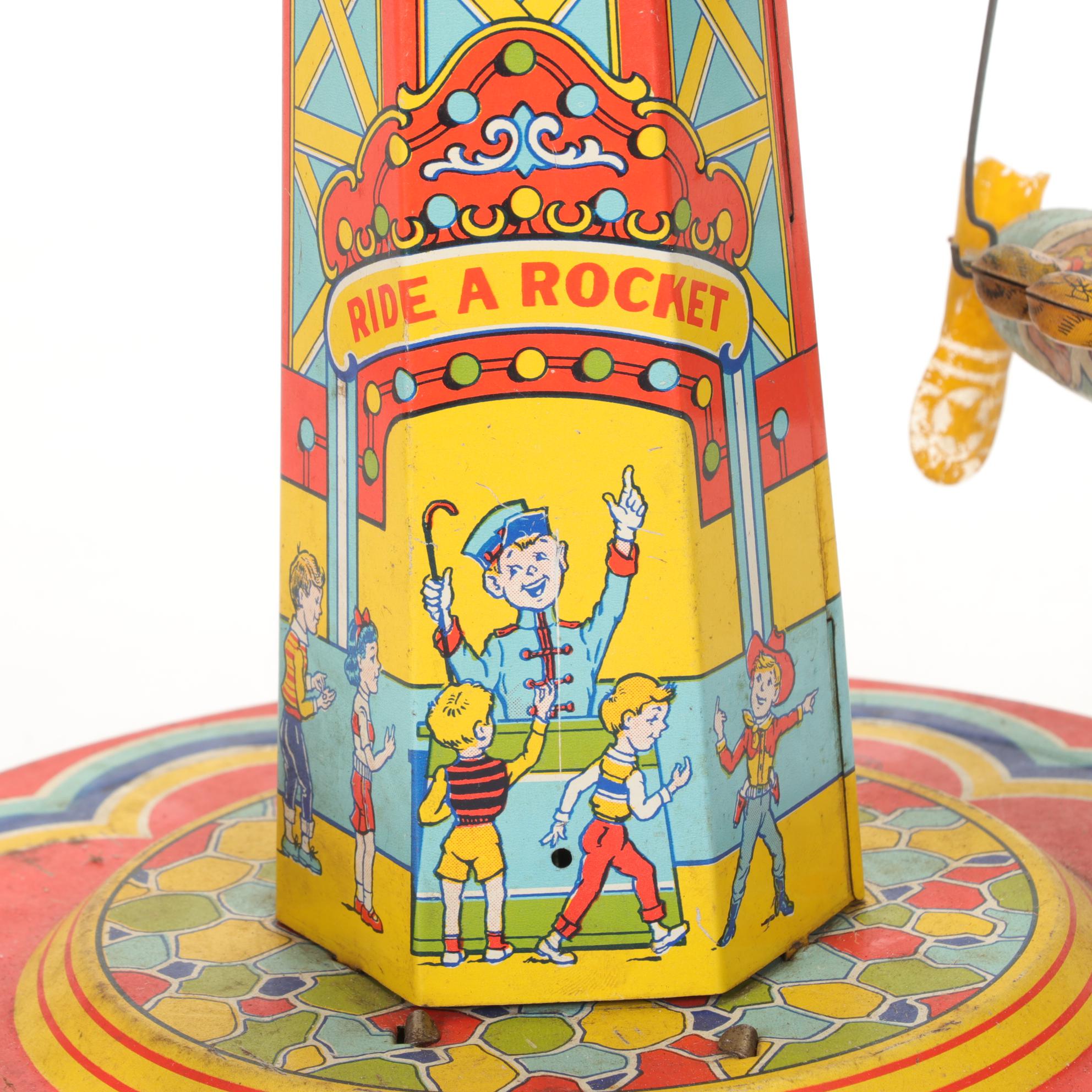 J. Chein "Ride a Rocket" Tin Litho Wind-Up Toy with Two Ohio Art Metal Tops