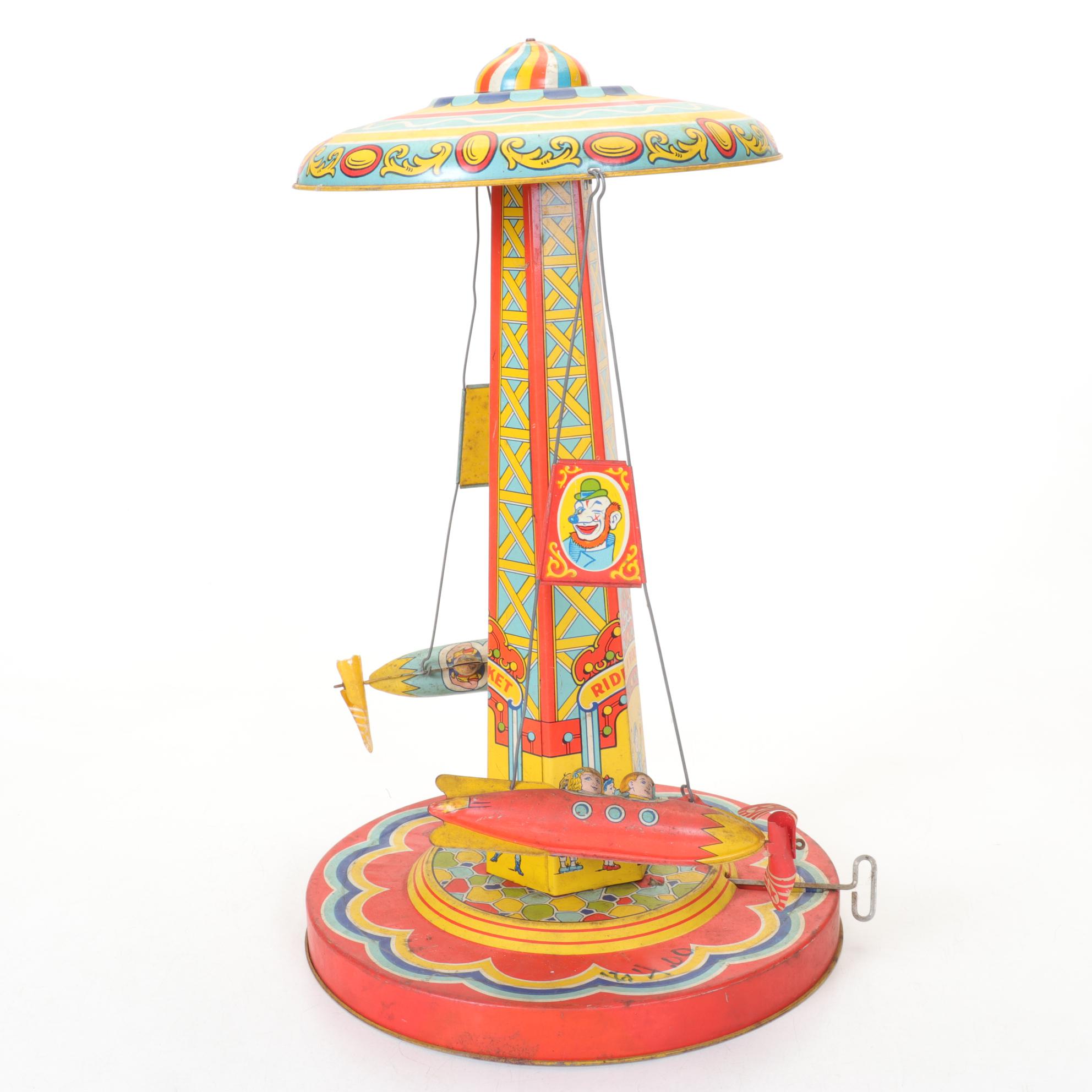 J. Chein "Ride a Rocket" Tin Litho Wind-Up Toy with Two Ohio Art Metal Tops