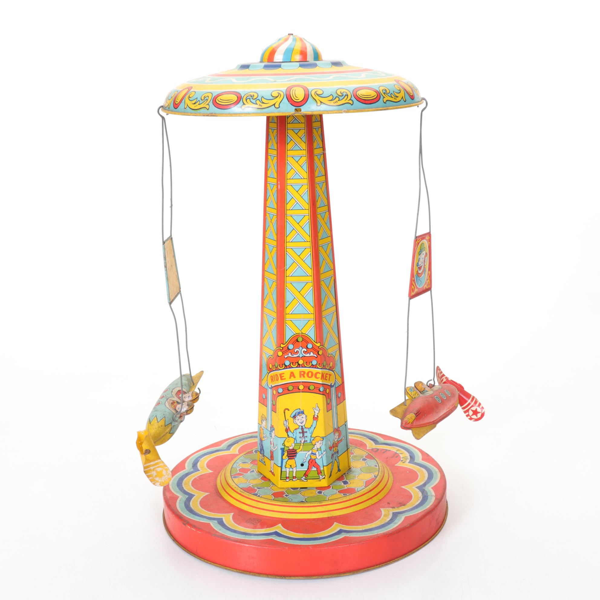 J. Chein "Ride a Rocket" Tin Litho Wind-Up Toy with Two Ohio Art Metal Tops