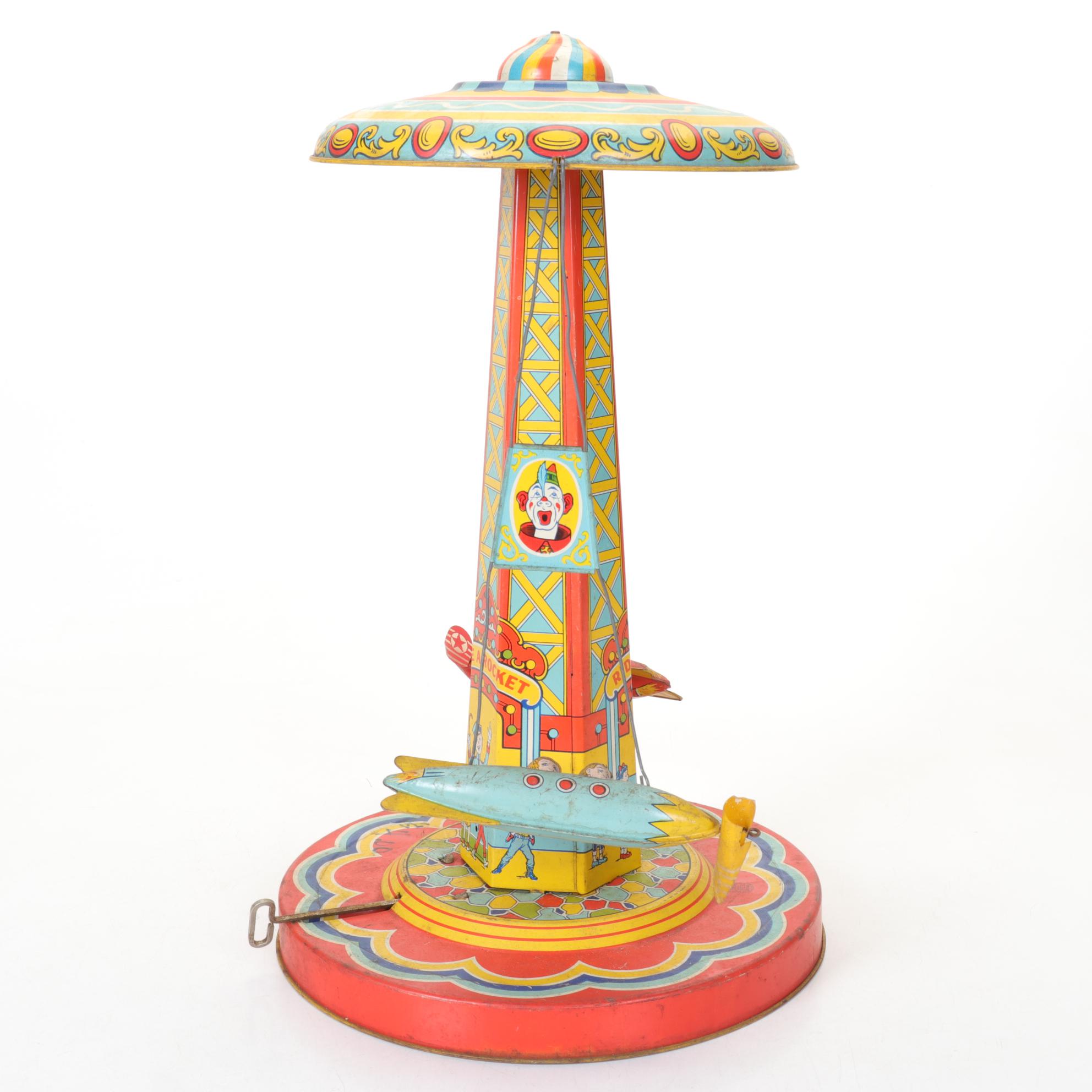 J. Chein "Ride a Rocket" Tin Litho Wind-Up Toy with Two Ohio Art Metal Tops