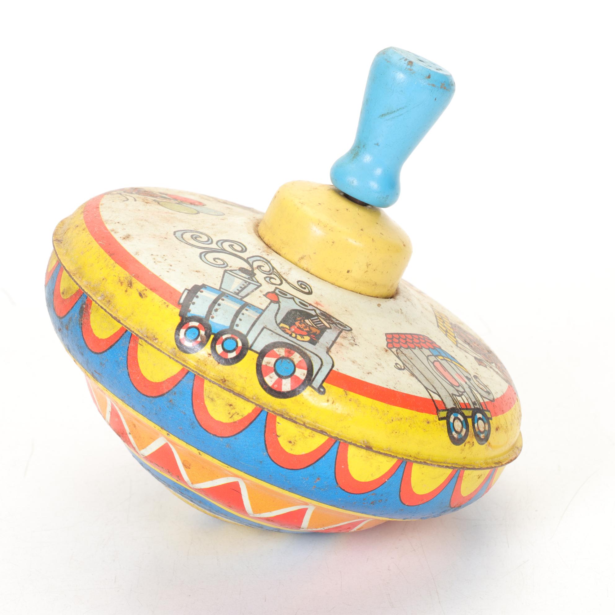 J. Chein "Ride a Rocket" Tin Litho Wind-Up Toy with Two Ohio Art Metal Tops