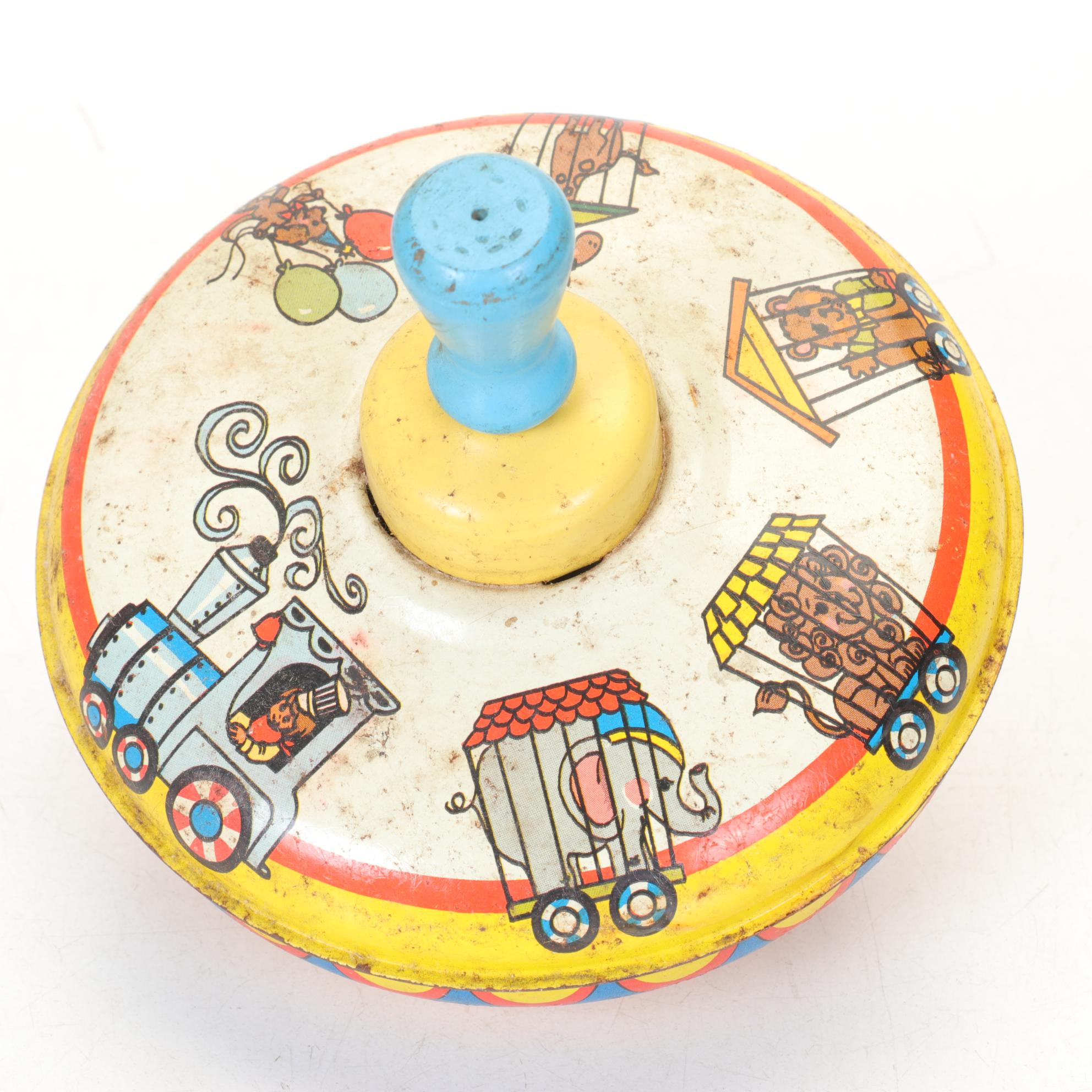 J. Chein "Ride a Rocket" Tin Litho Wind-Up Toy with Two Ohio Art Metal Tops