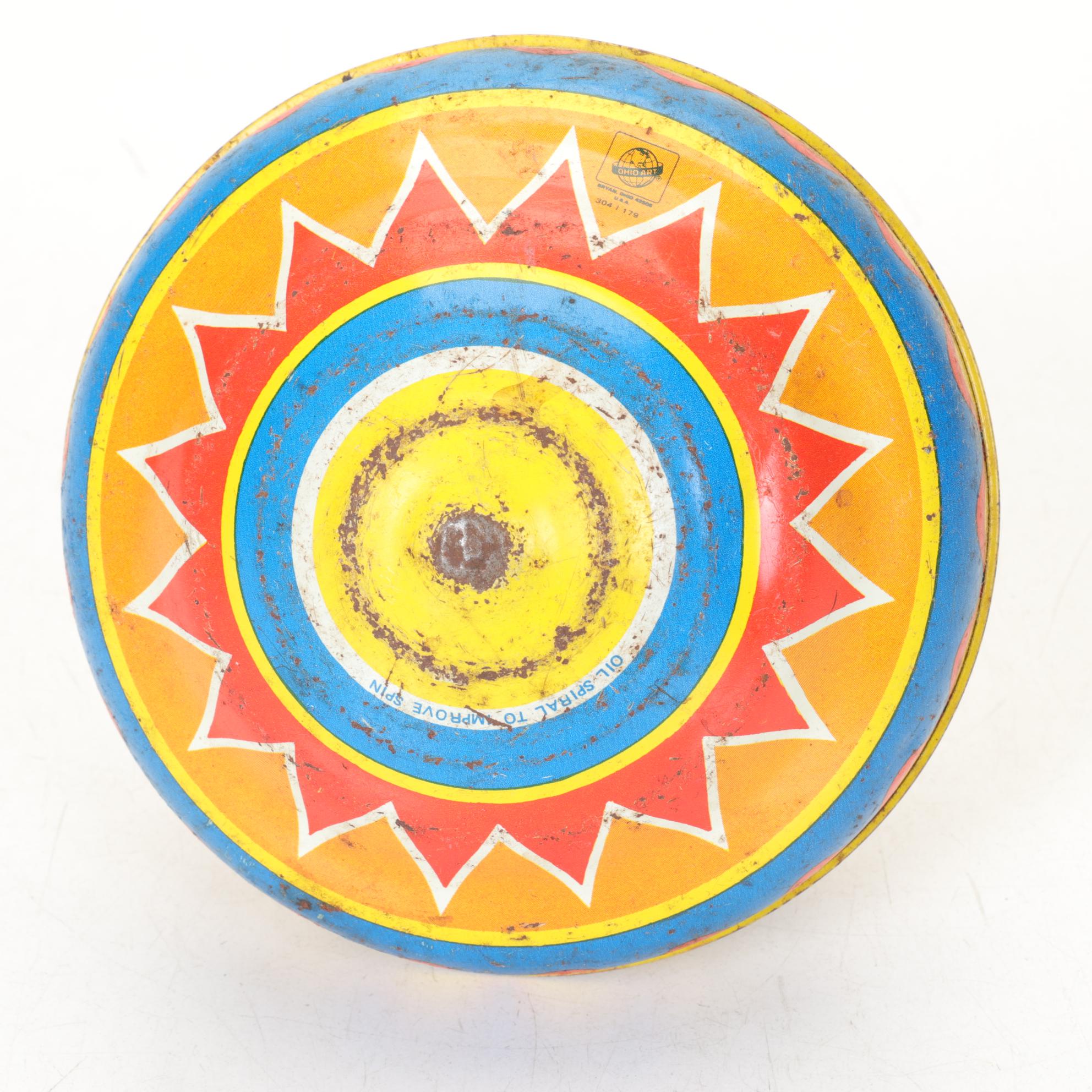 J. Chein "Ride a Rocket" Tin Litho Wind-Up Toy with Two Ohio Art Metal Tops