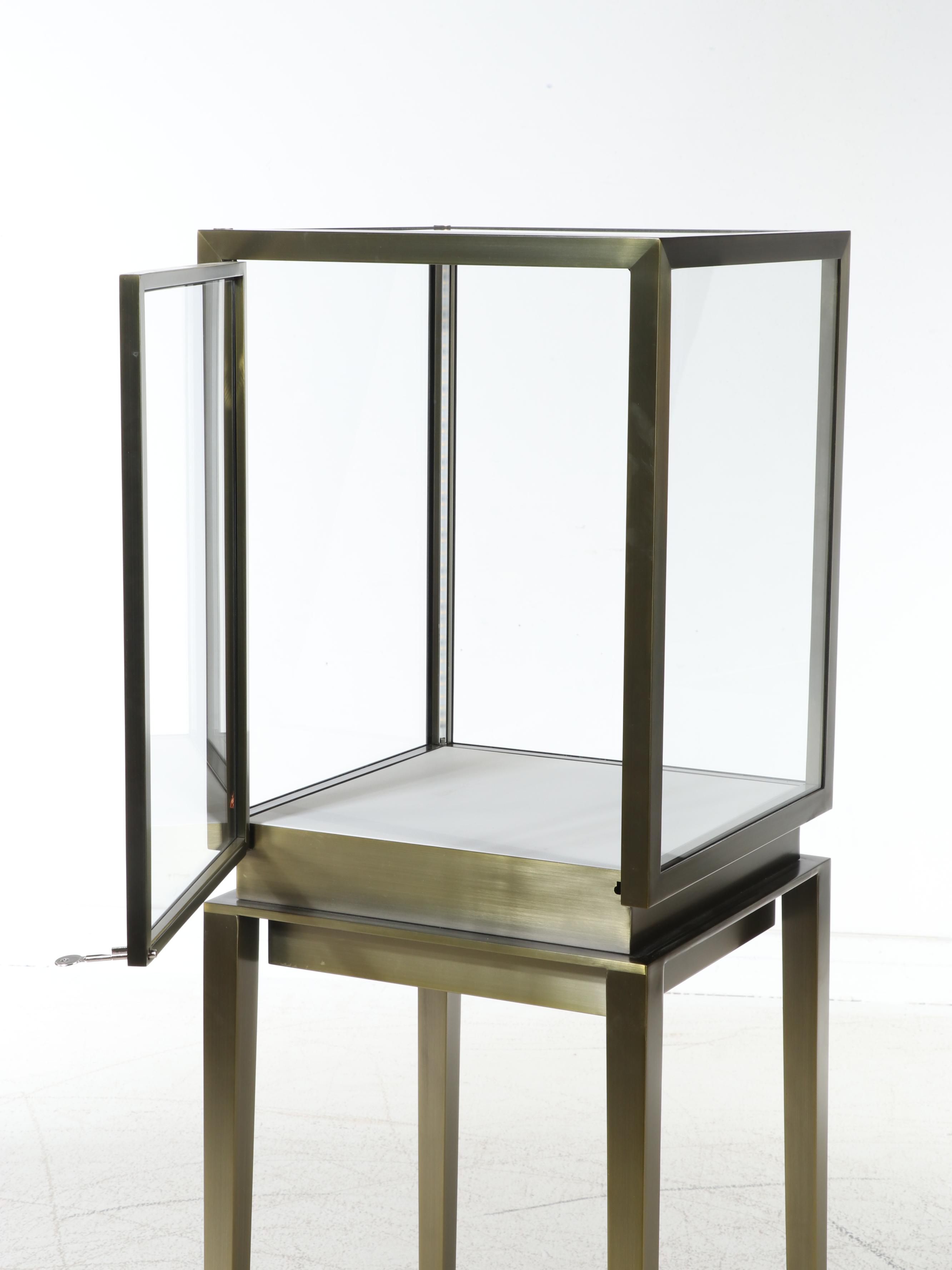 Displays2Go Mid Century Modern Style Metal and Glass Illuminated Display Case