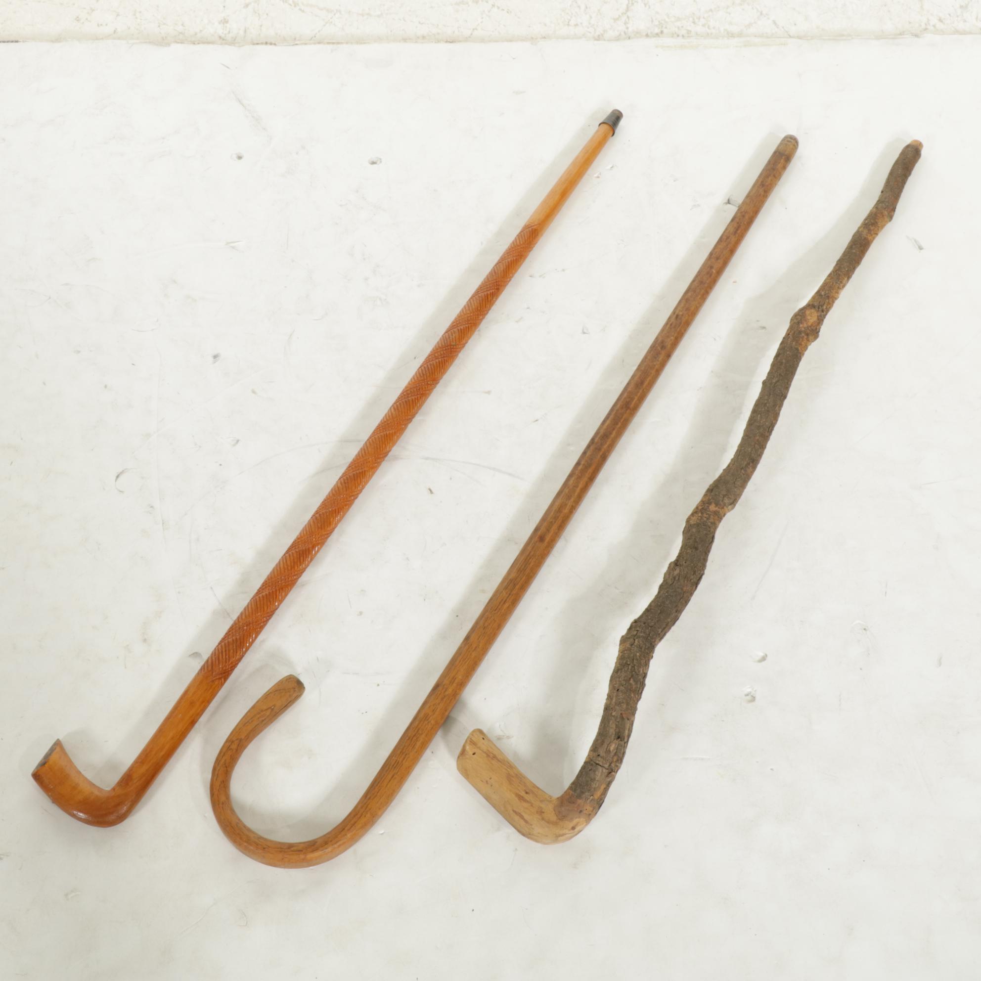 Walnut Shepherd's Hook Cane with Two Other Wood Canes