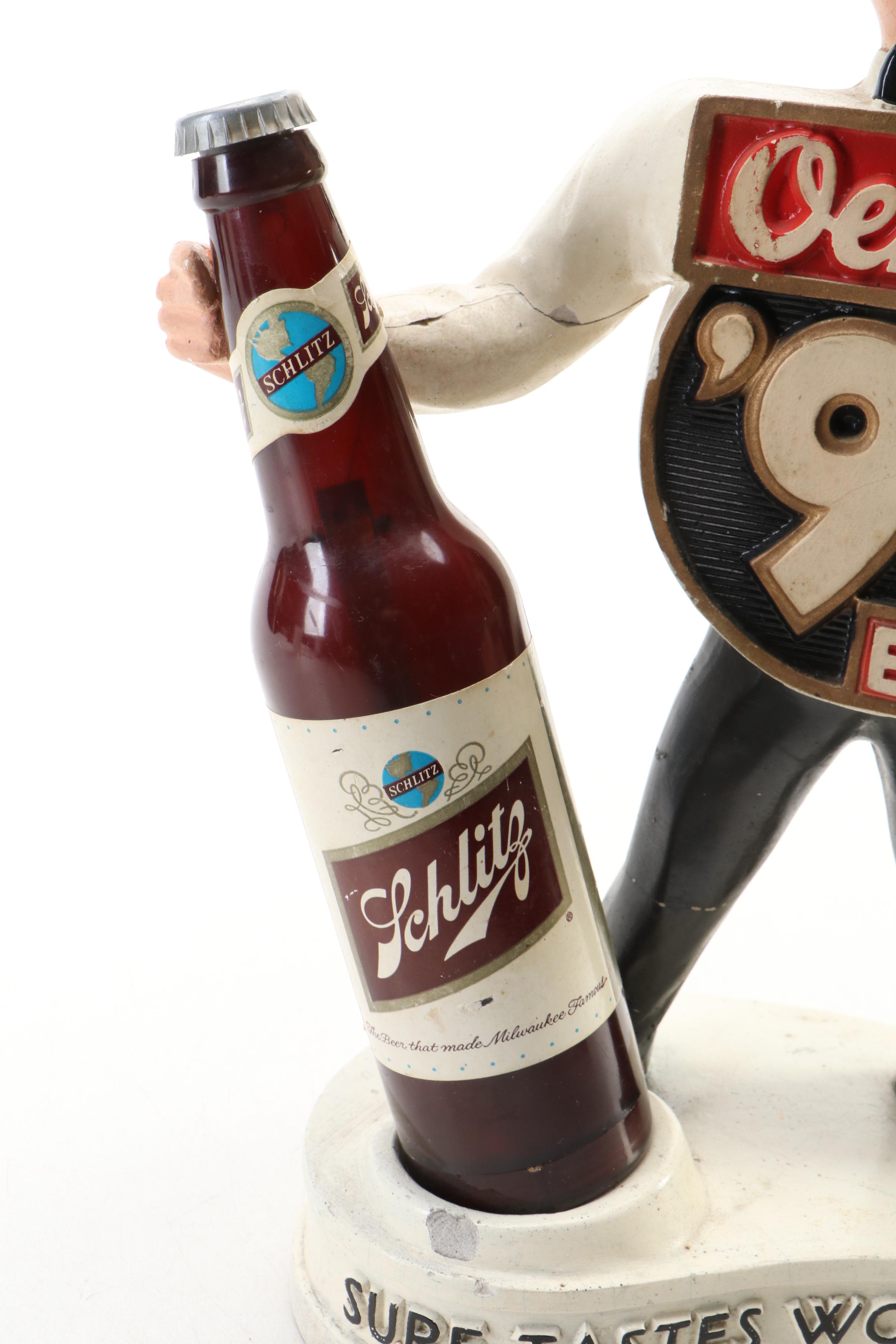 Oertel's Beer "Sure Tastes Wonderful" Advertising Figurine with Schlitz Bottle