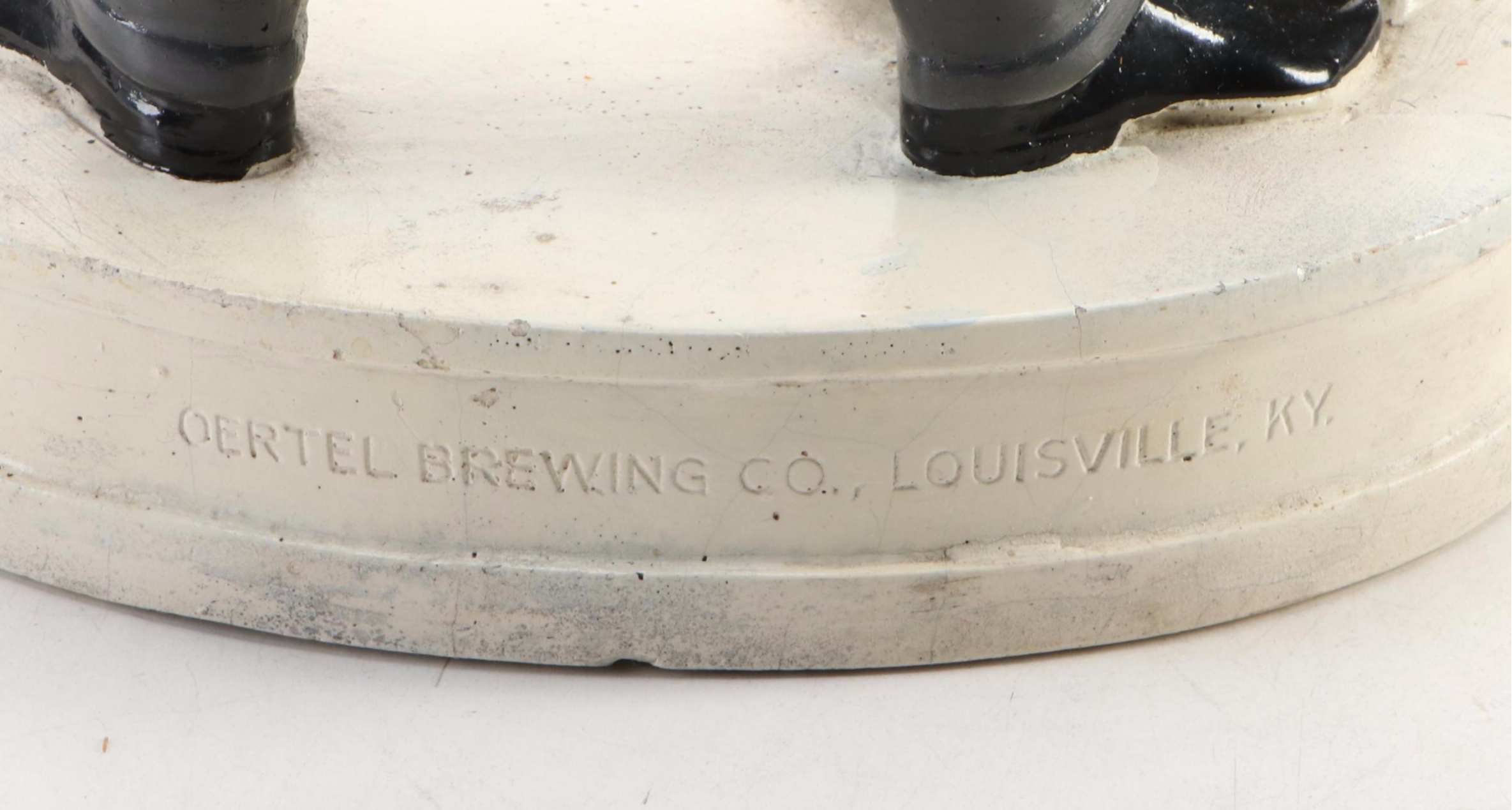 Oertel's Beer "Sure Tastes Wonderful" Advertising Figurine with Schlitz Bottle