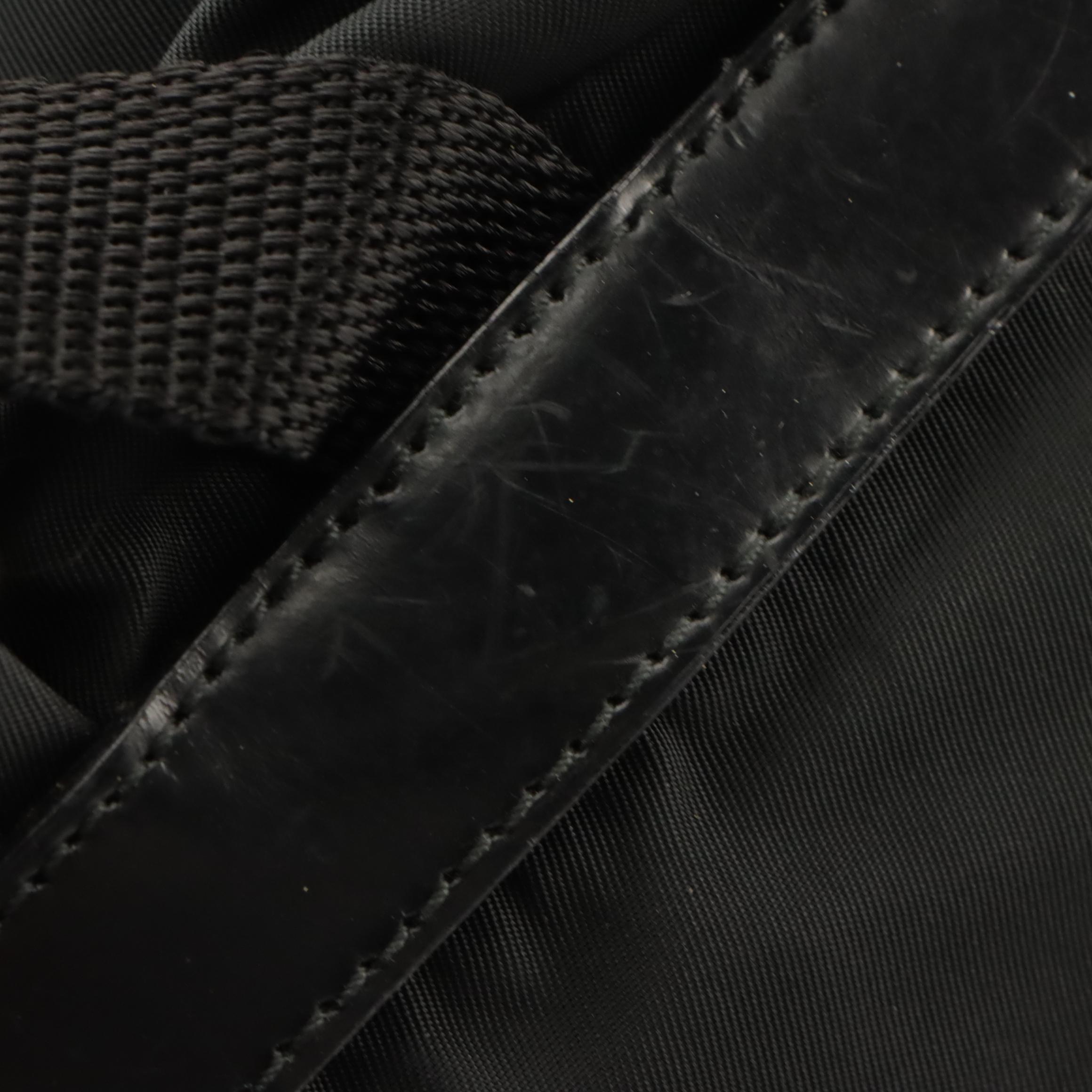 Prada Front Pocket Drawstring Backpack Bag in Nylon and Glazed Leather