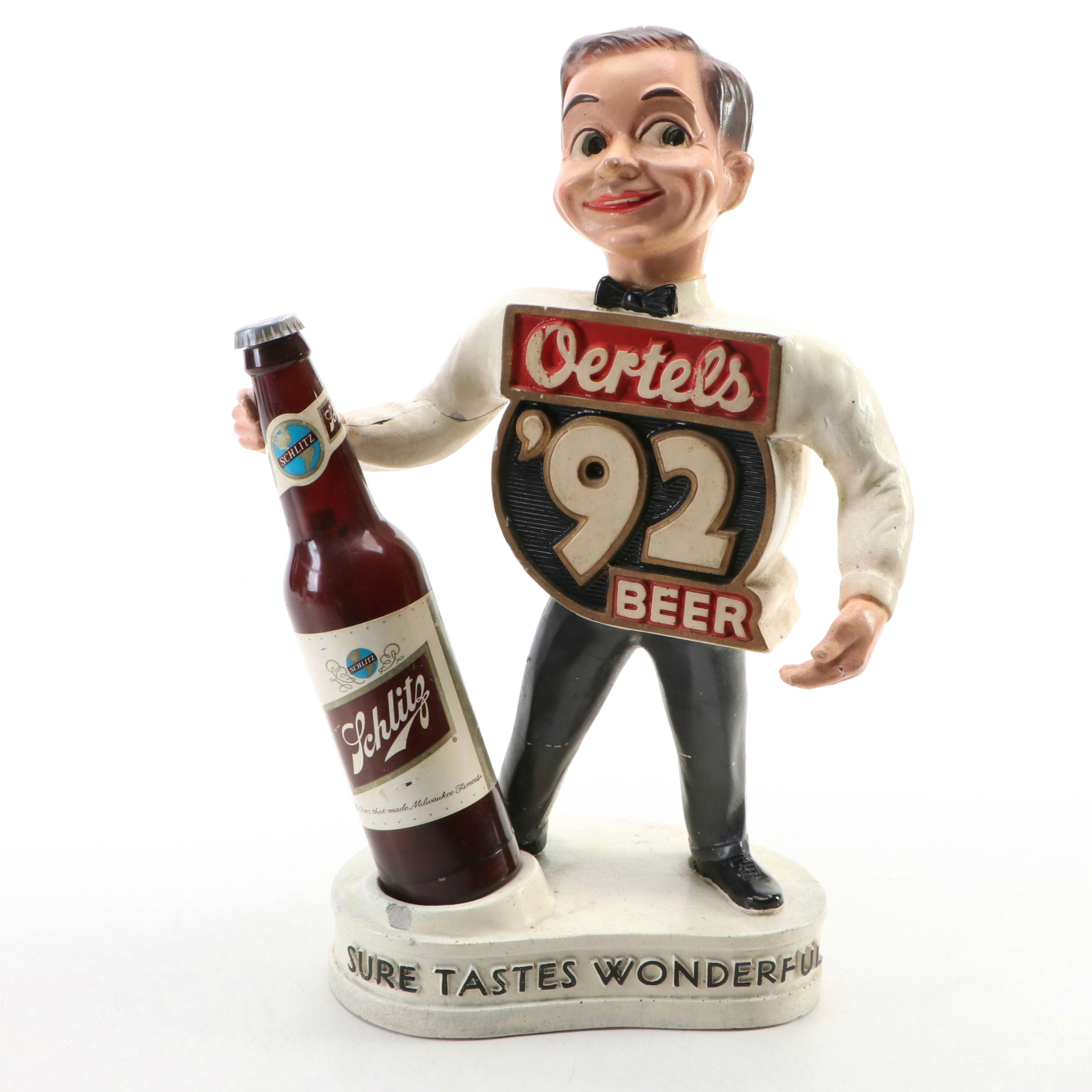 Oertel's Beer "Sure Tastes Wonderful" Advertising Figurine with Schlitz Bottle