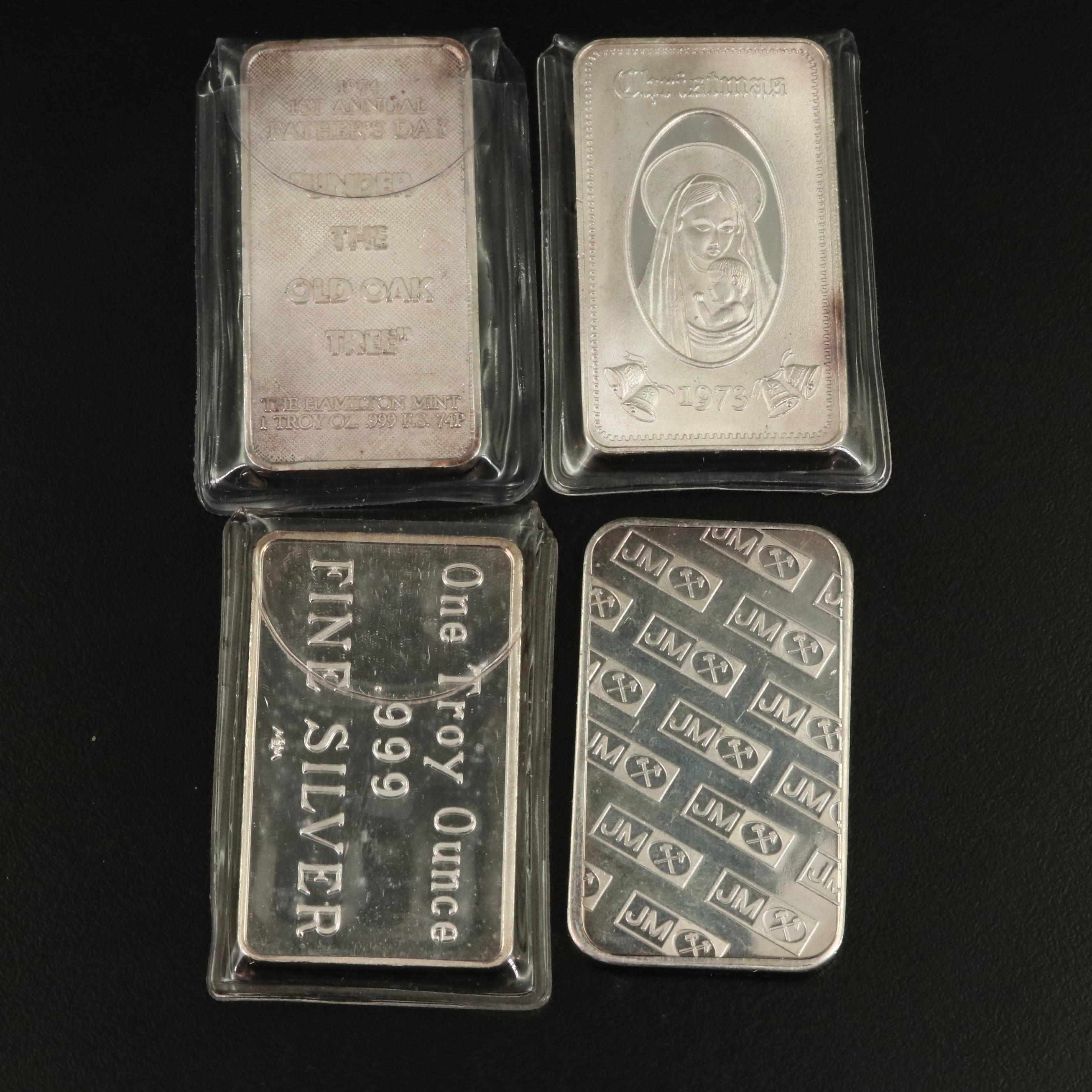 Six One Ounce Silver Bars and a Silver Round