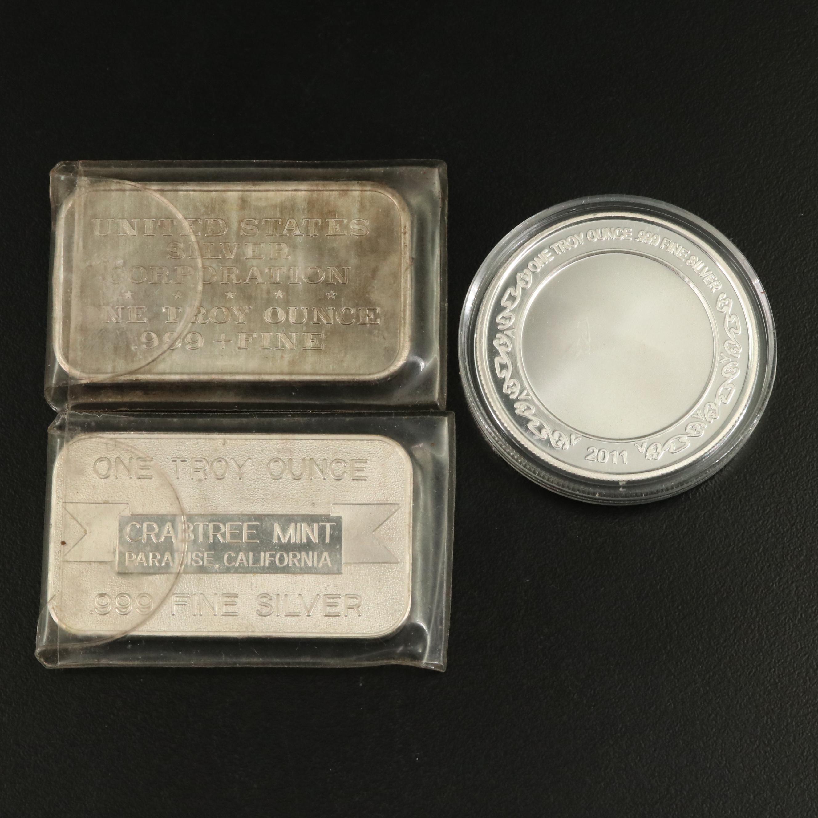 Six One Ounce Silver Bars and a Silver Round