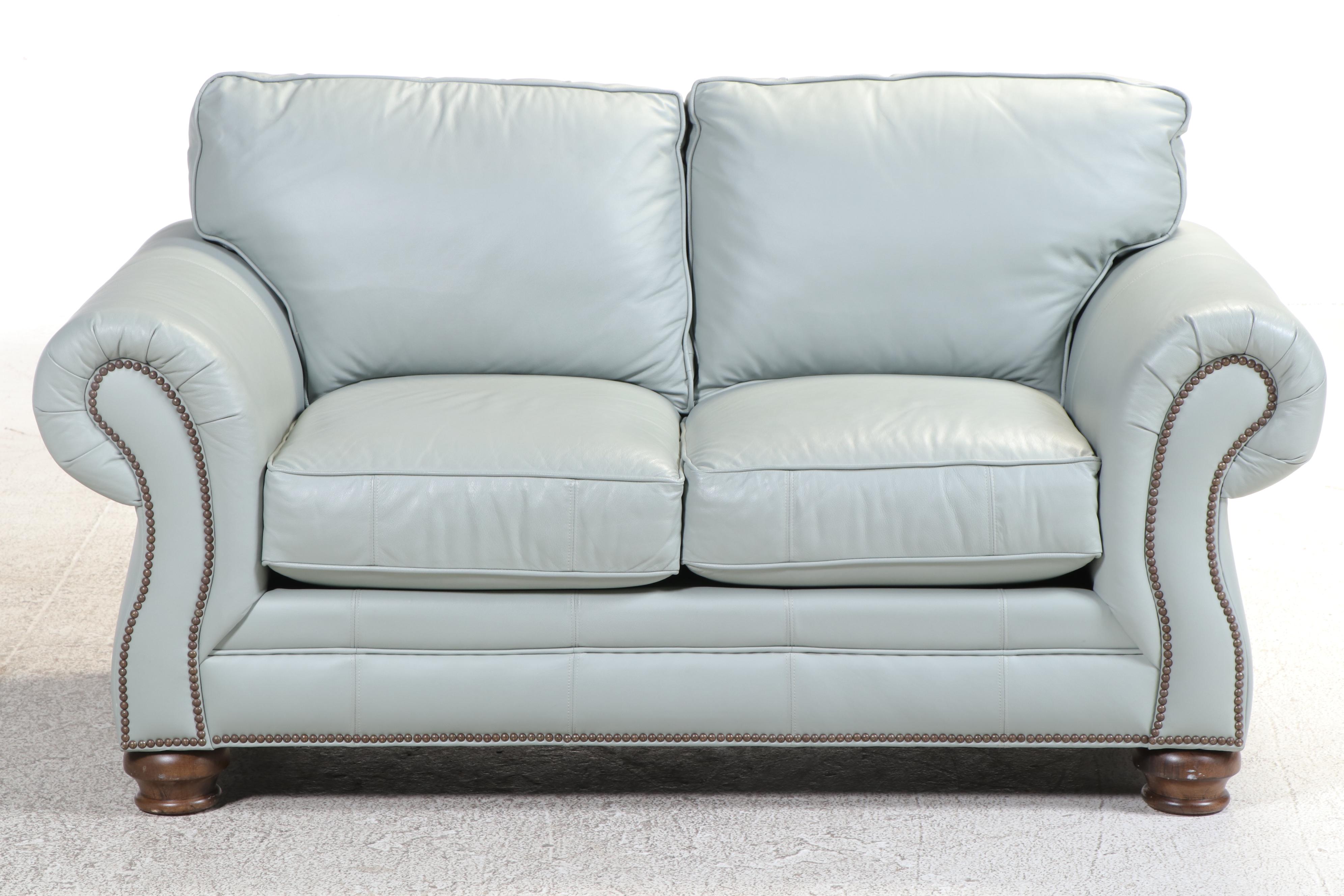 Bassett Leather Loveseat with Nailhead and Wooden Bun Feet