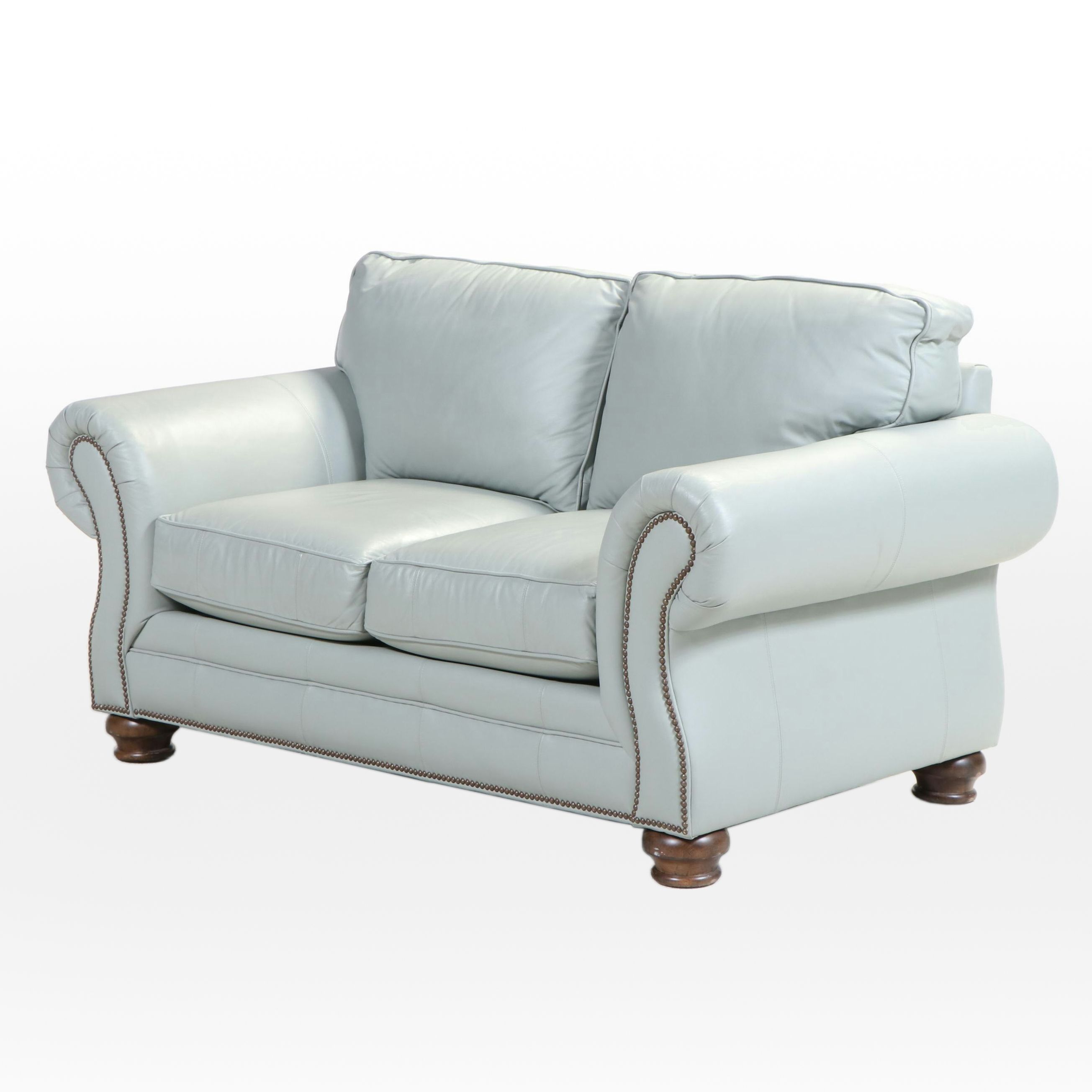 Bassett Leather Loveseat with Nailhead and Wooden Bun Feet