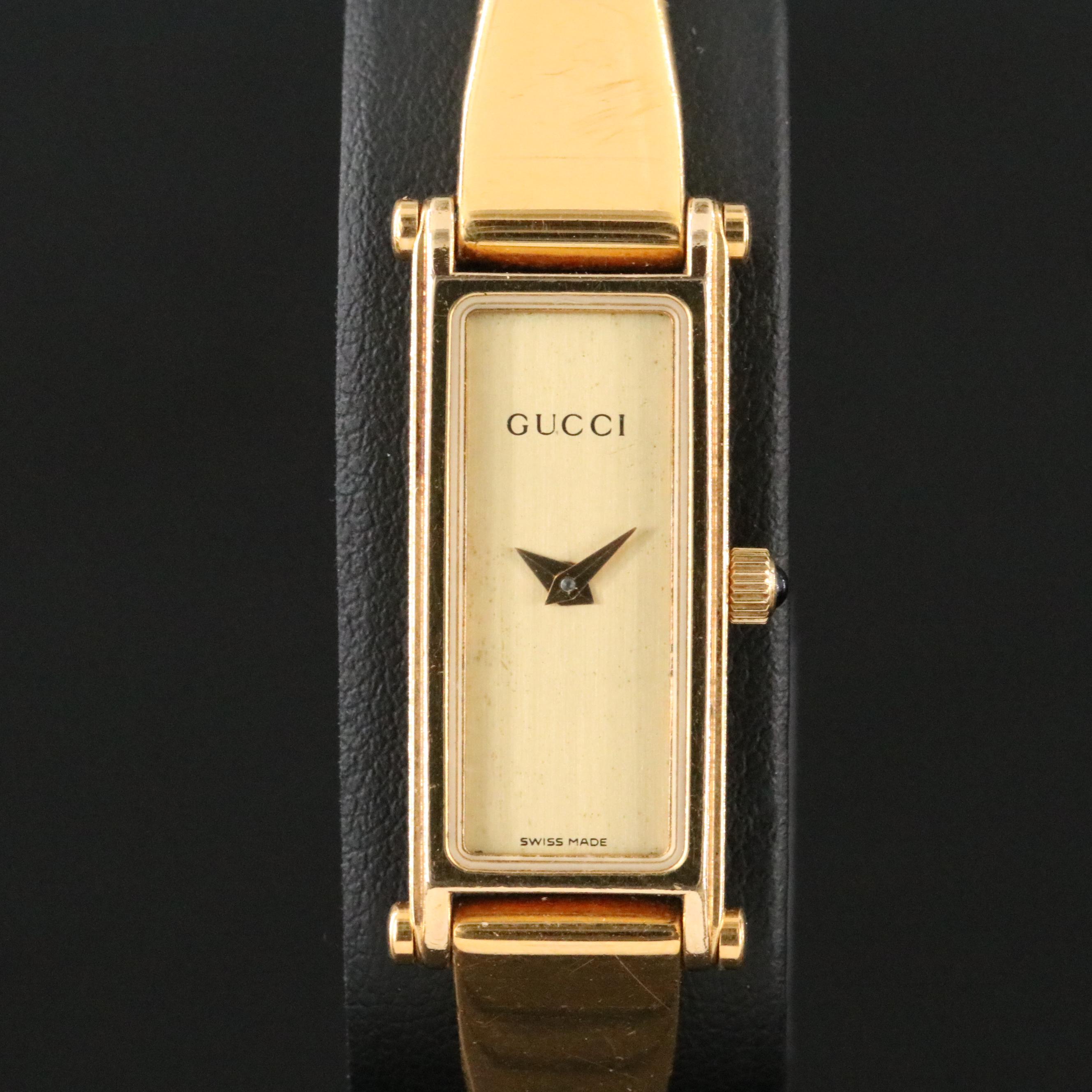 Gucci Yellow Tone Bangle and Stirrup Watch