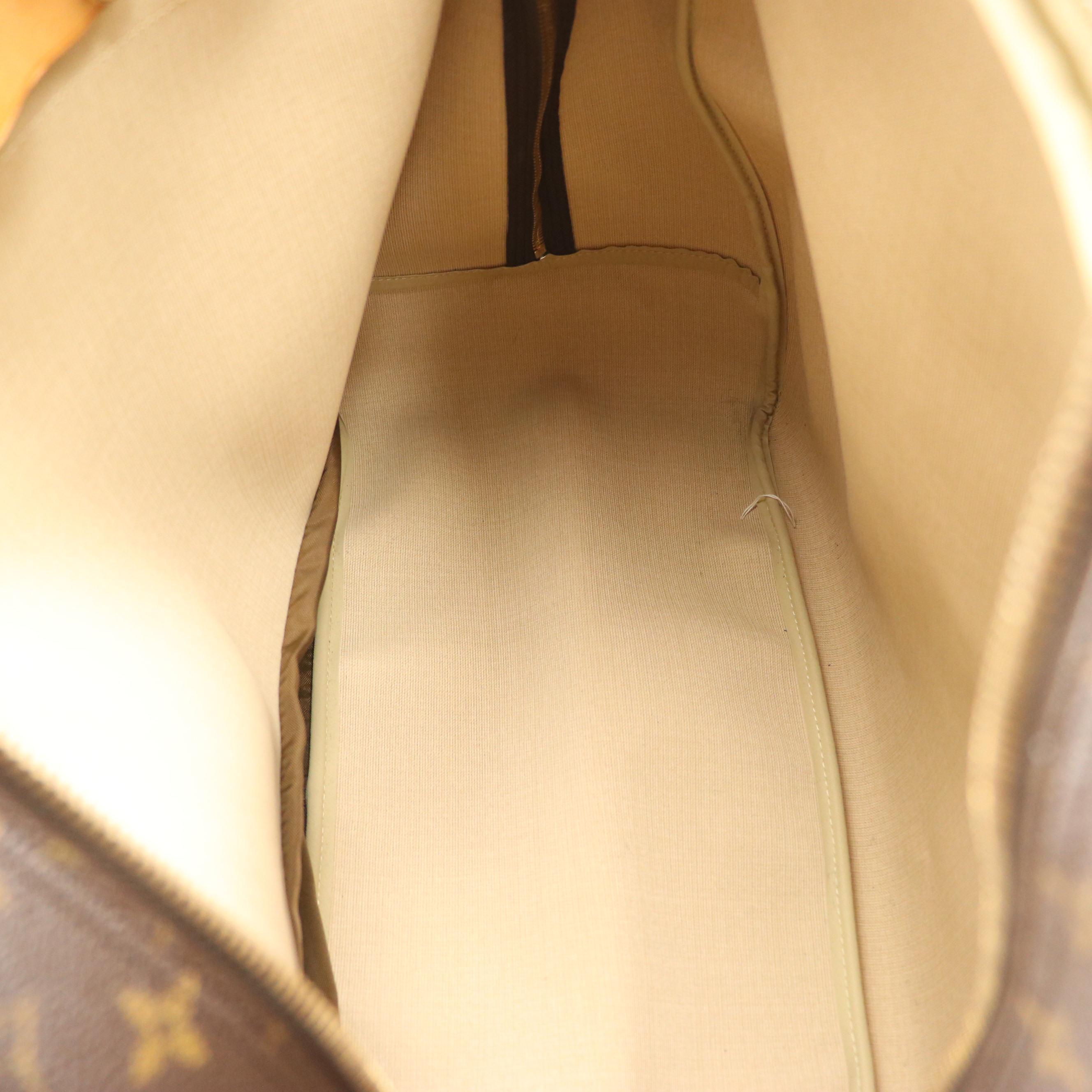 Louis Vuitton Evasion Travel Bag in Monogram Canvas and Vachetta Leather