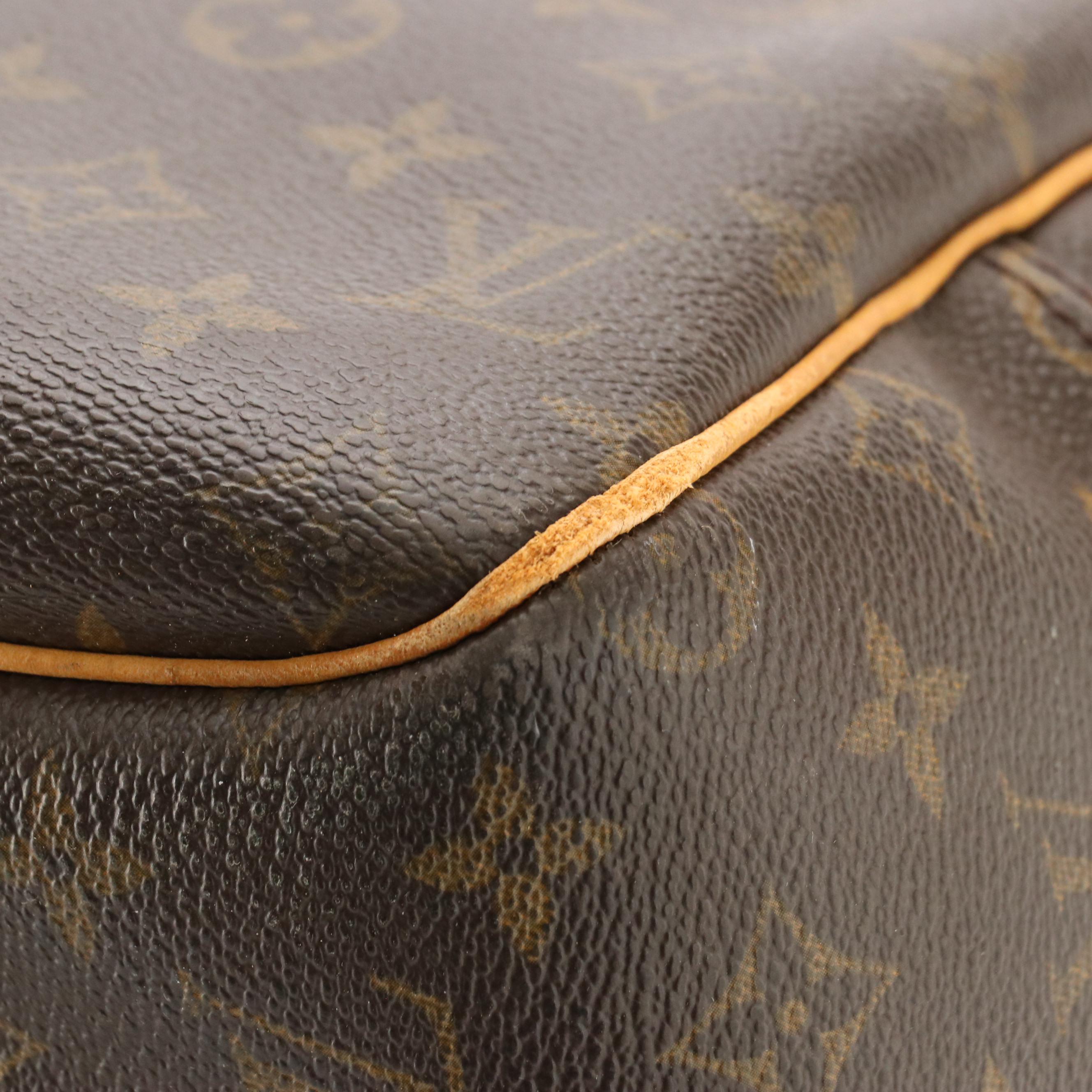 Louis Vuitton Evasion Travel Bag in Monogram Canvas and Vachetta Leather